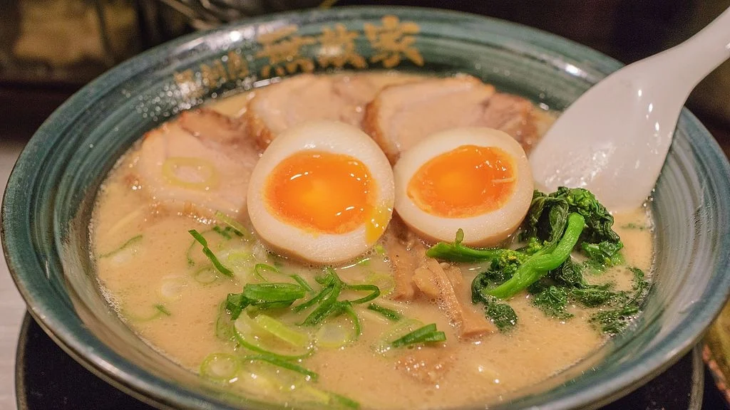 Image: Mutekiya Ramen by Wei-Te Wong . Creative Commons Attribution-Share Alike 2.0 Generic license via Wikimedia Commons . Thumbnail Image: Ramen Bowl Figurines by Janine . Creative Commons Attribution 2.0 Generic via Wikimedia Commons .