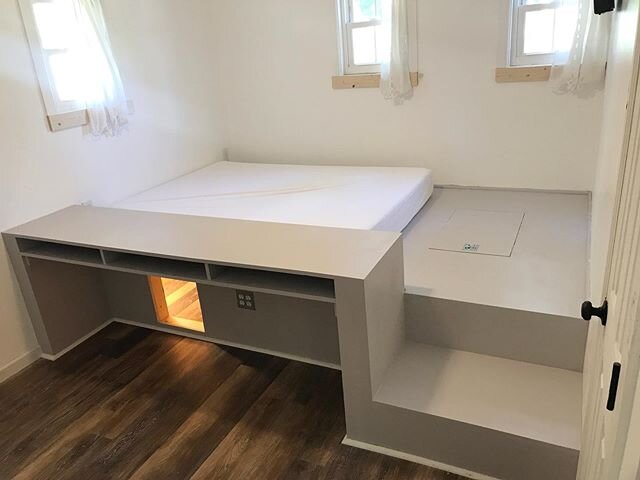 The platform bedroom renovation is coming along nicely! We painted it yesterday and have just a few finishing touches left before our teen moves into her new room. The trap door in the floor at the foot of the bed has an electric lift to open it. Jus