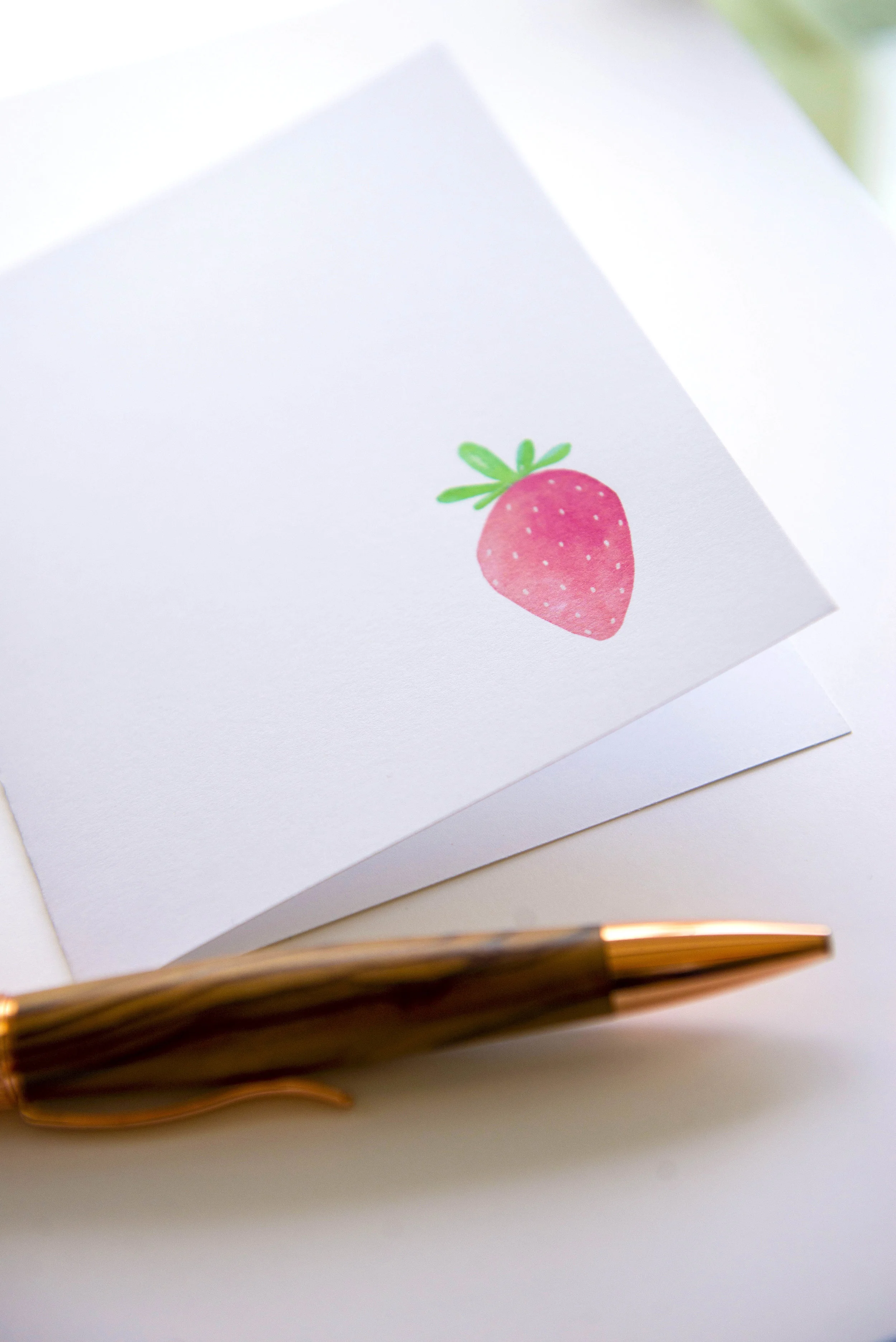 Printable watercolor greeting card featuring a sweet pink strawberry in the lower right corner. Download once and print again and again!  Prints (2) cards per 8.5x11 inch paper. 
