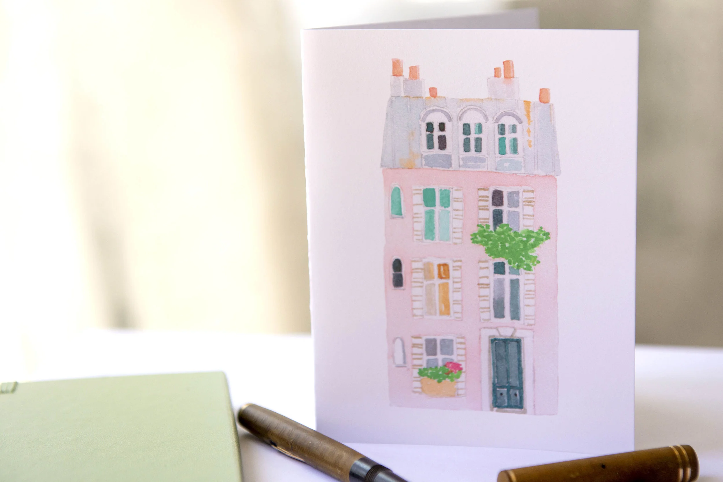 Printable watercolor greeting cards featuring a pink Parisian building. Download once and print again and again!  Prints (2) cards per 8.5x11 inch paper. 