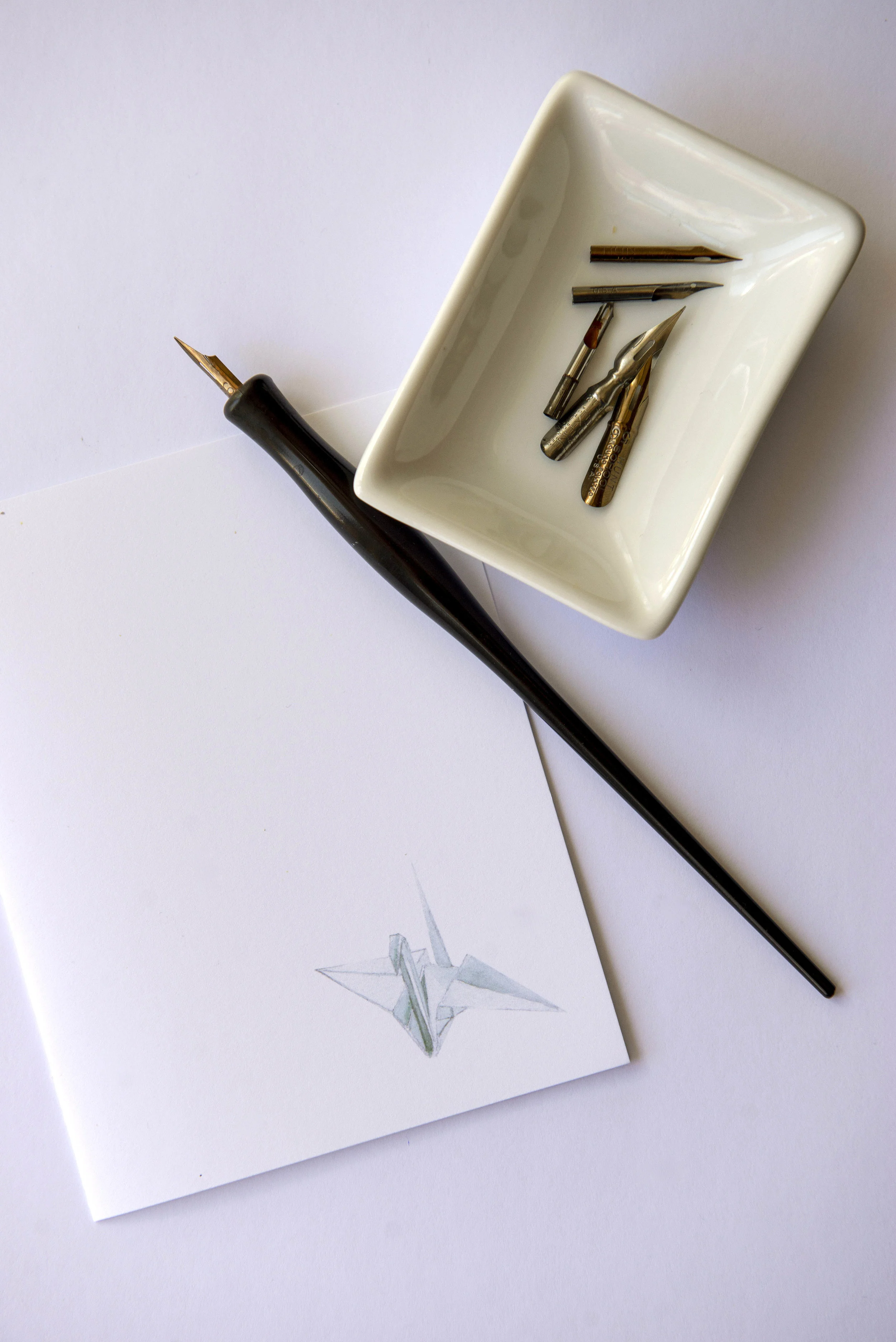Printable watercolor greeting card featuring a little paper crane in the lower right corner. Download once and print again and again!  Prints (2) cards per 8.5x11 inch paper. 