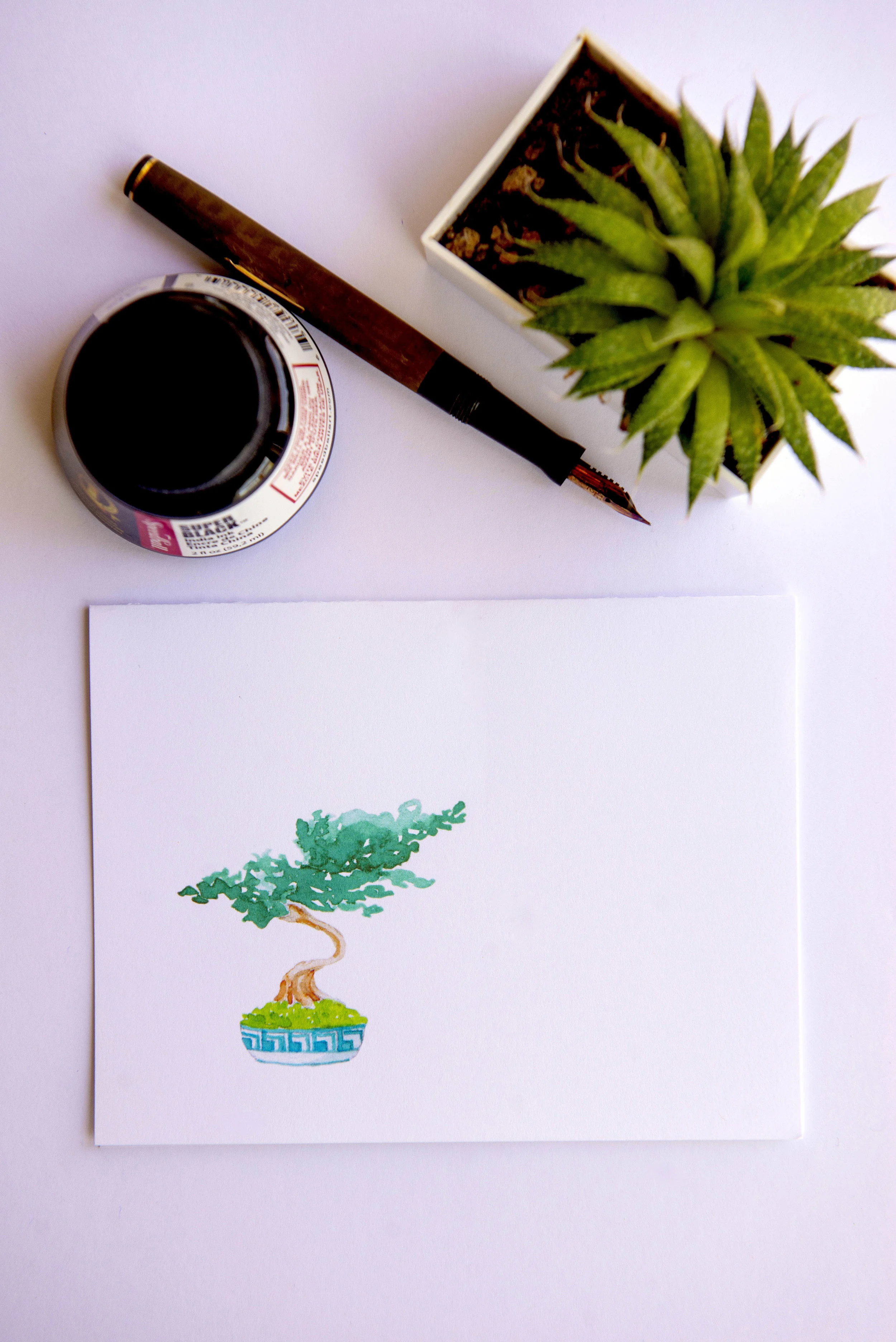 Printable watercolor greeting card featuring a small bonsai tree in the lower left corner. Download once and print again and again!  Prints (2) cards per 8.5x11 inch paper. 