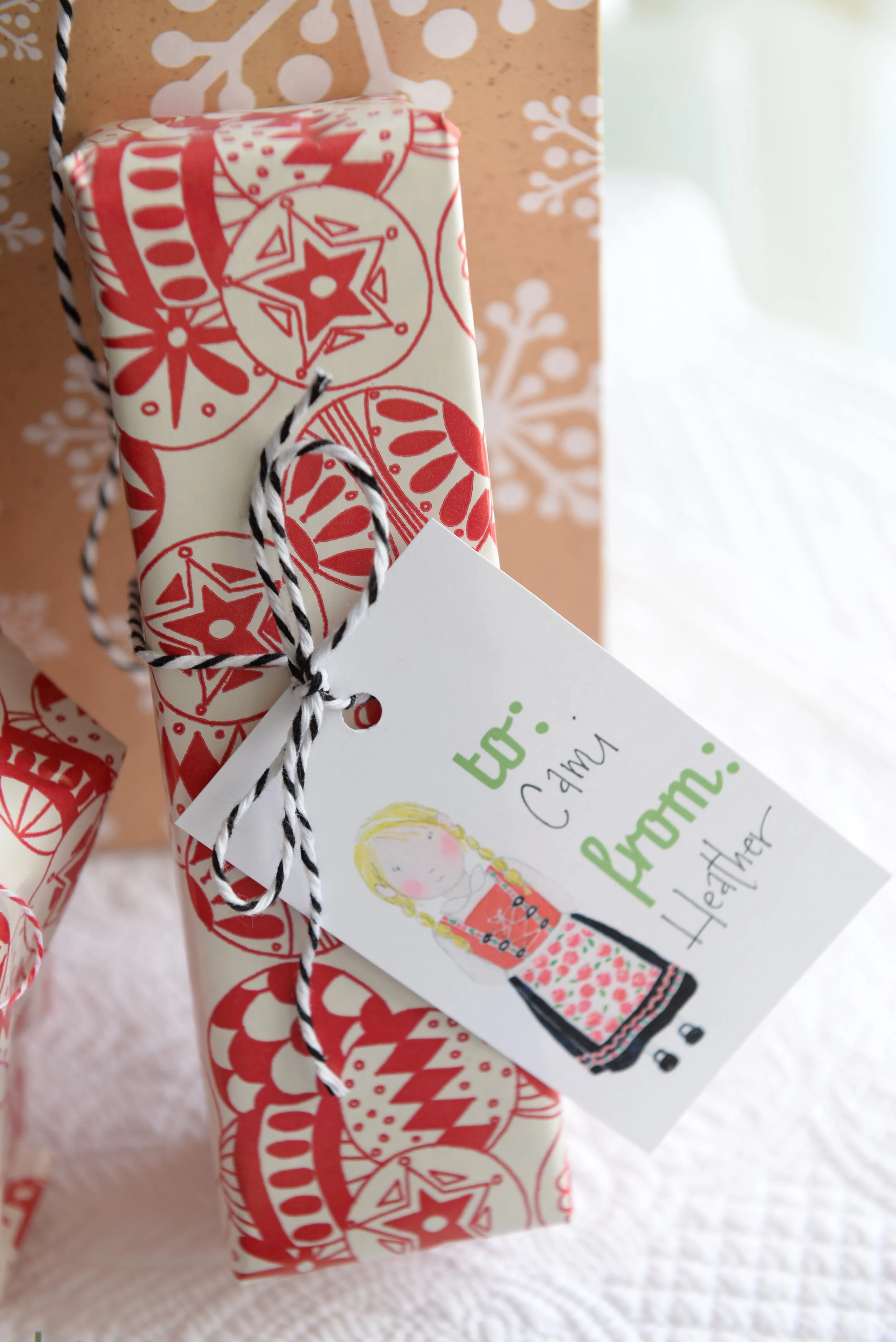 Printable watercolor gift tags featuring a Scandinavian girl in a traditional bunad dress.  Download and print your own Christmas gift tags!