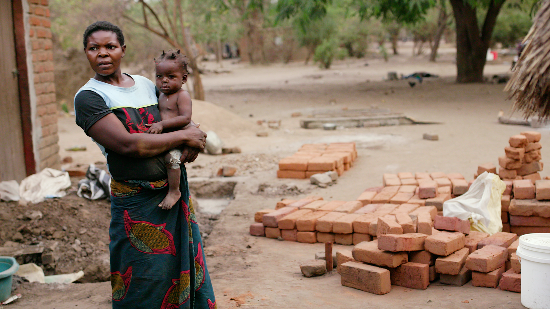 Woman in Village with Baby copy.png