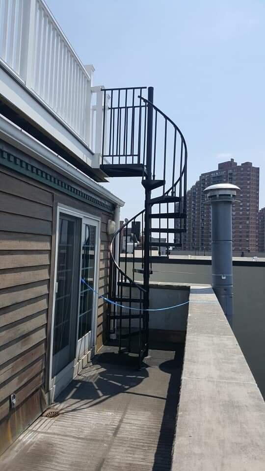 New spiral staircase going up to roof deck