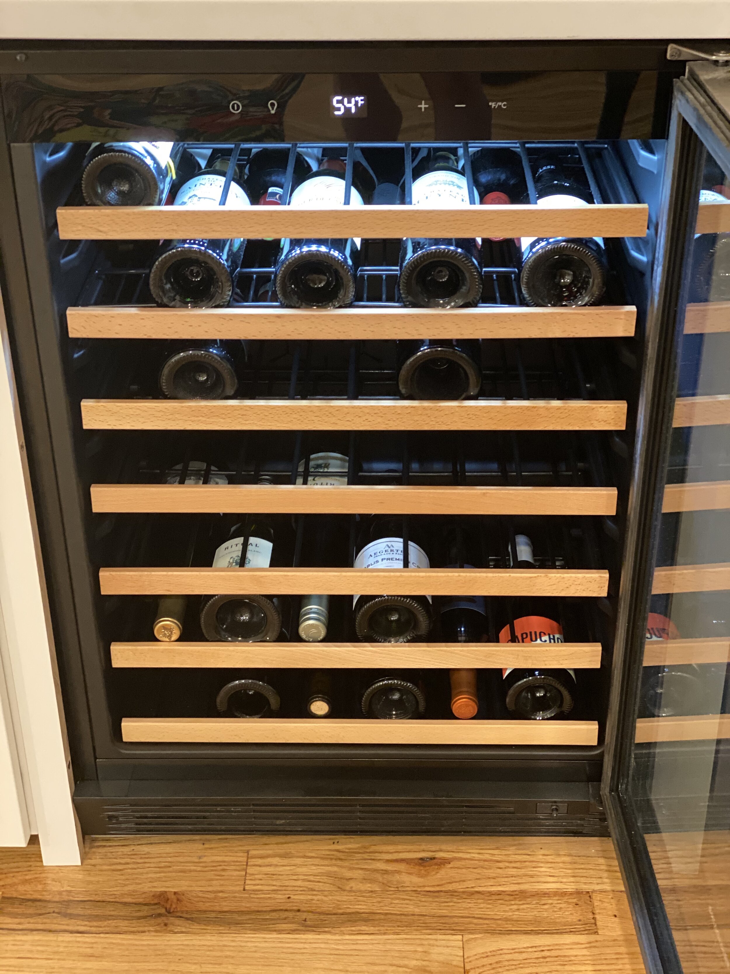 Wine fridge installed in custom bar