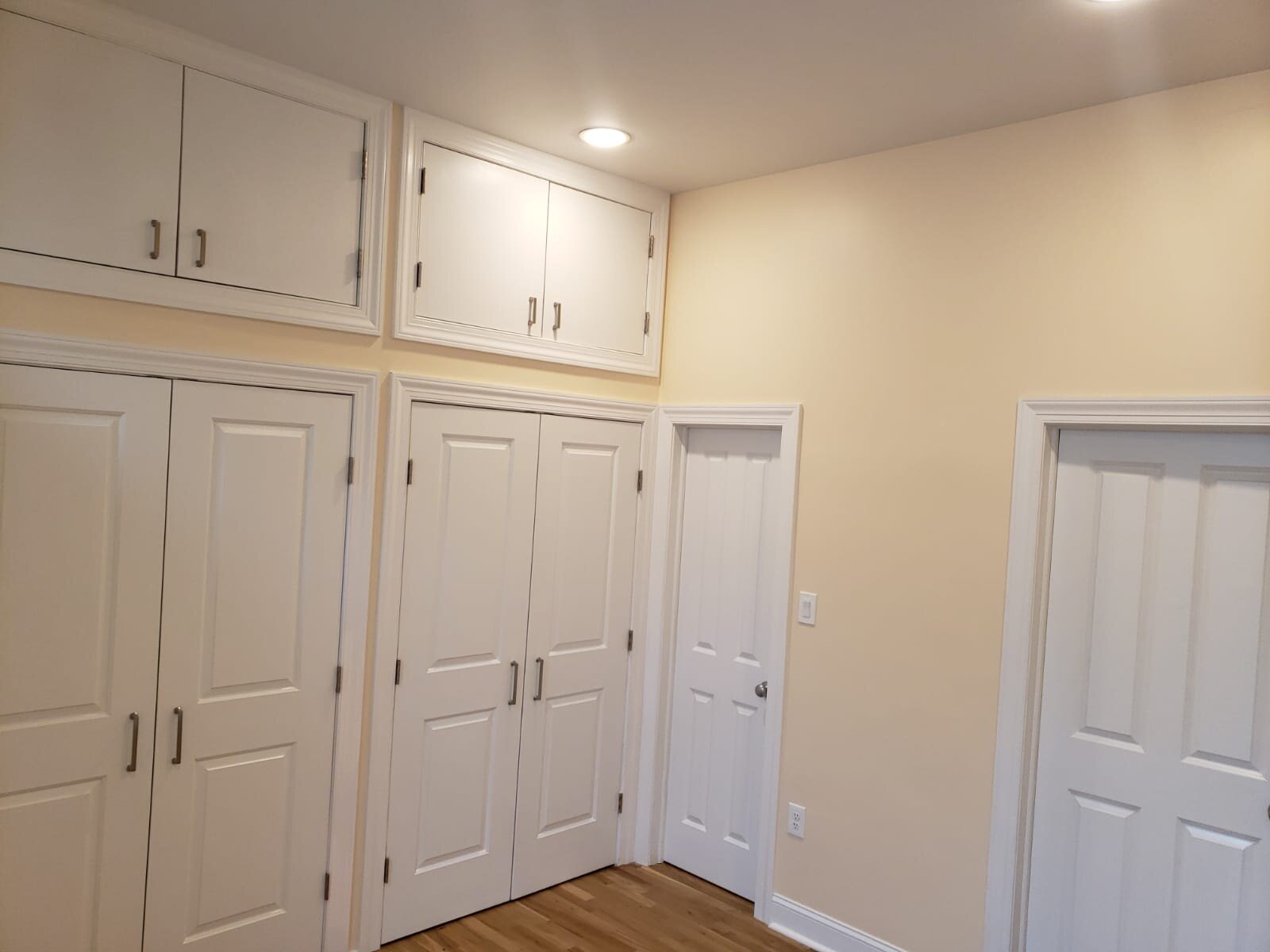 Custom closet build out with additional storage on top