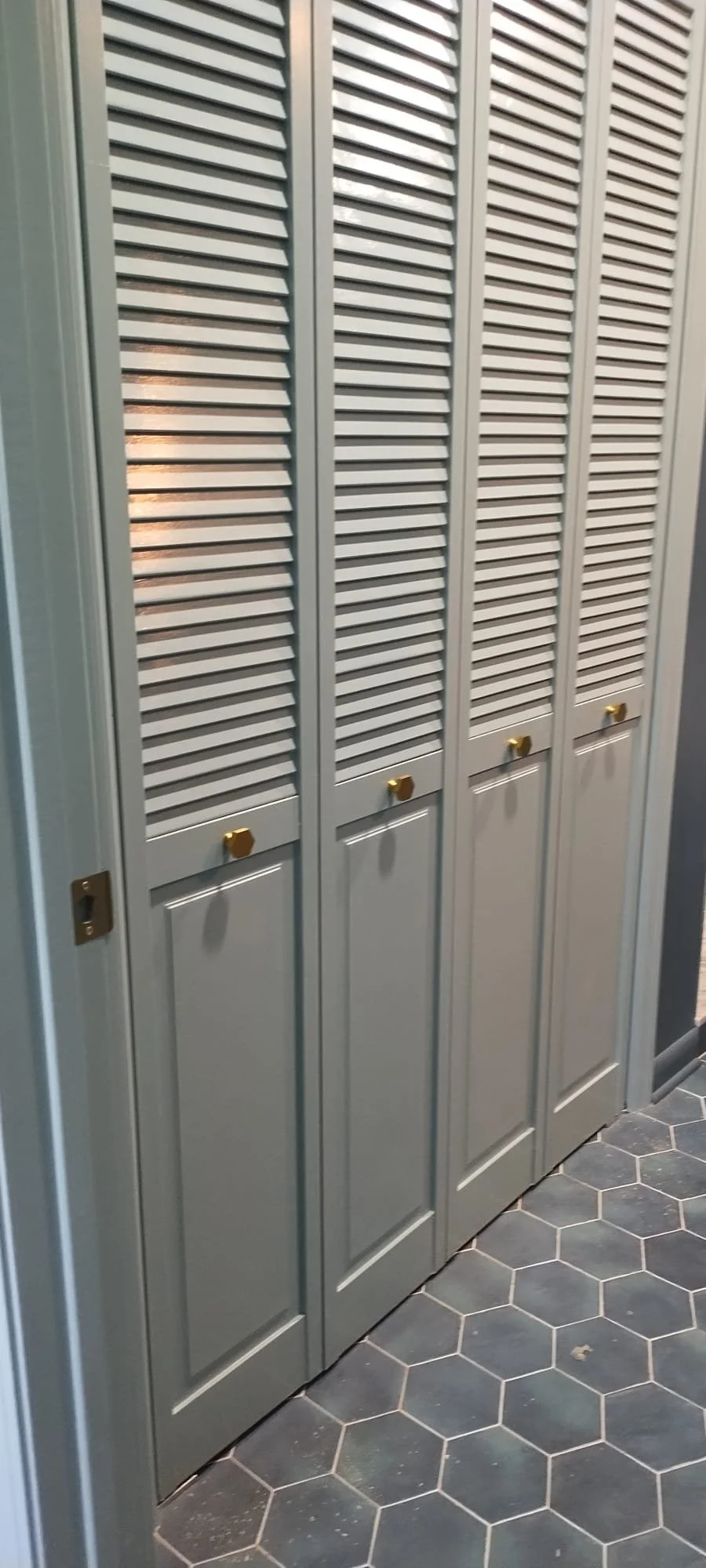 Double bi-fold doors in a renovated bathroom