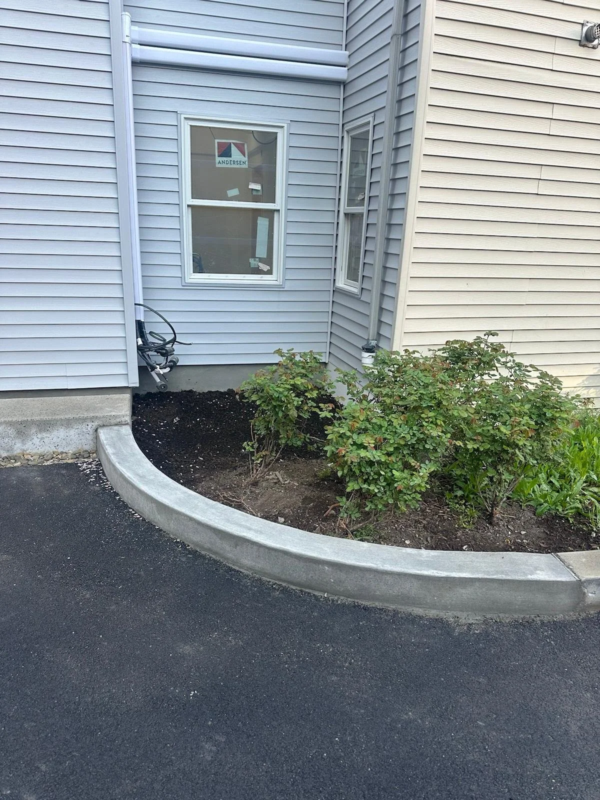New addition with new driveway curb