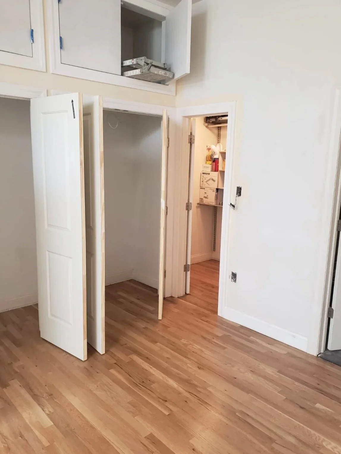 Custom closet with additional storage above