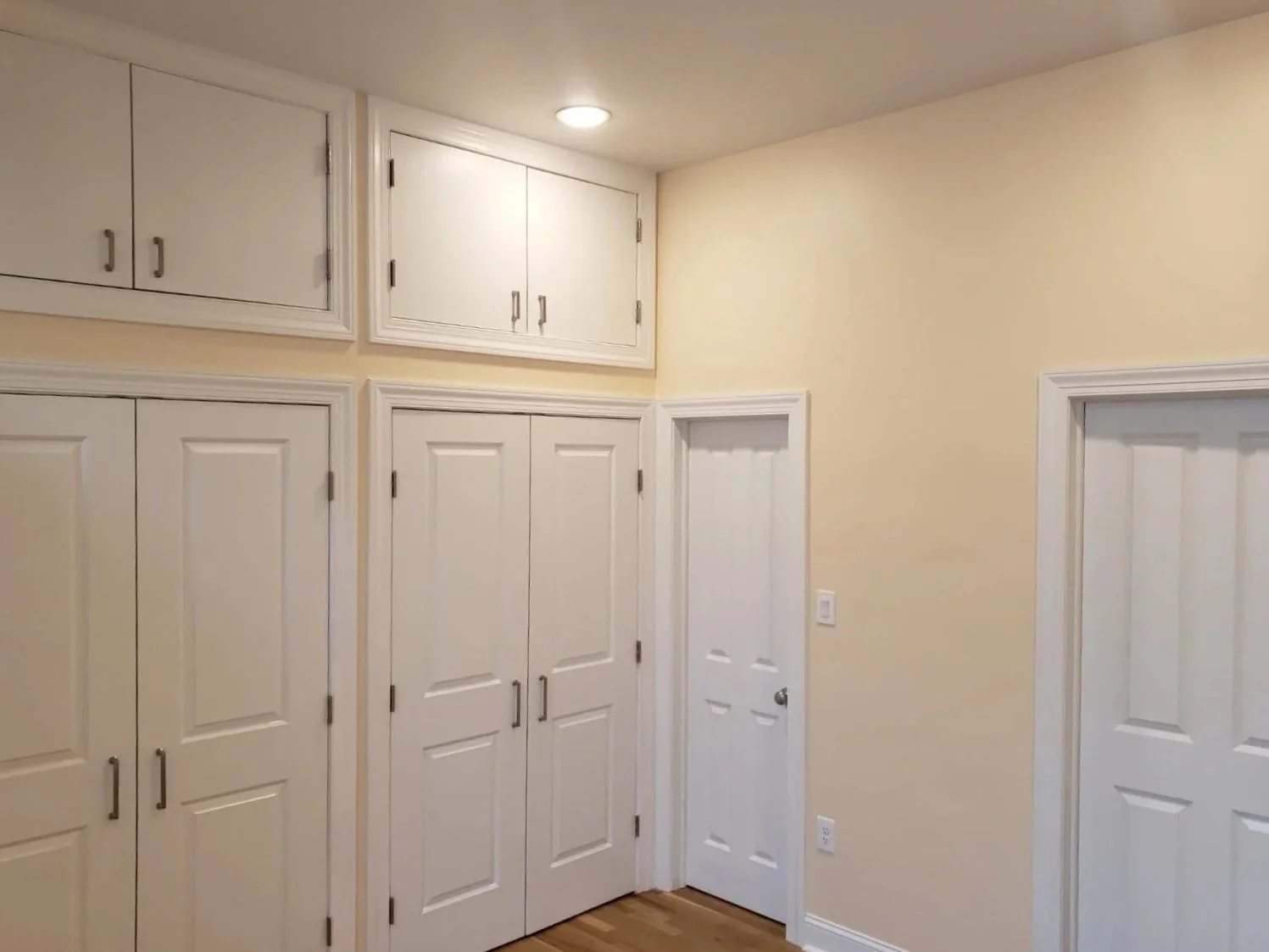 Custom closet build out with additional storage on top
