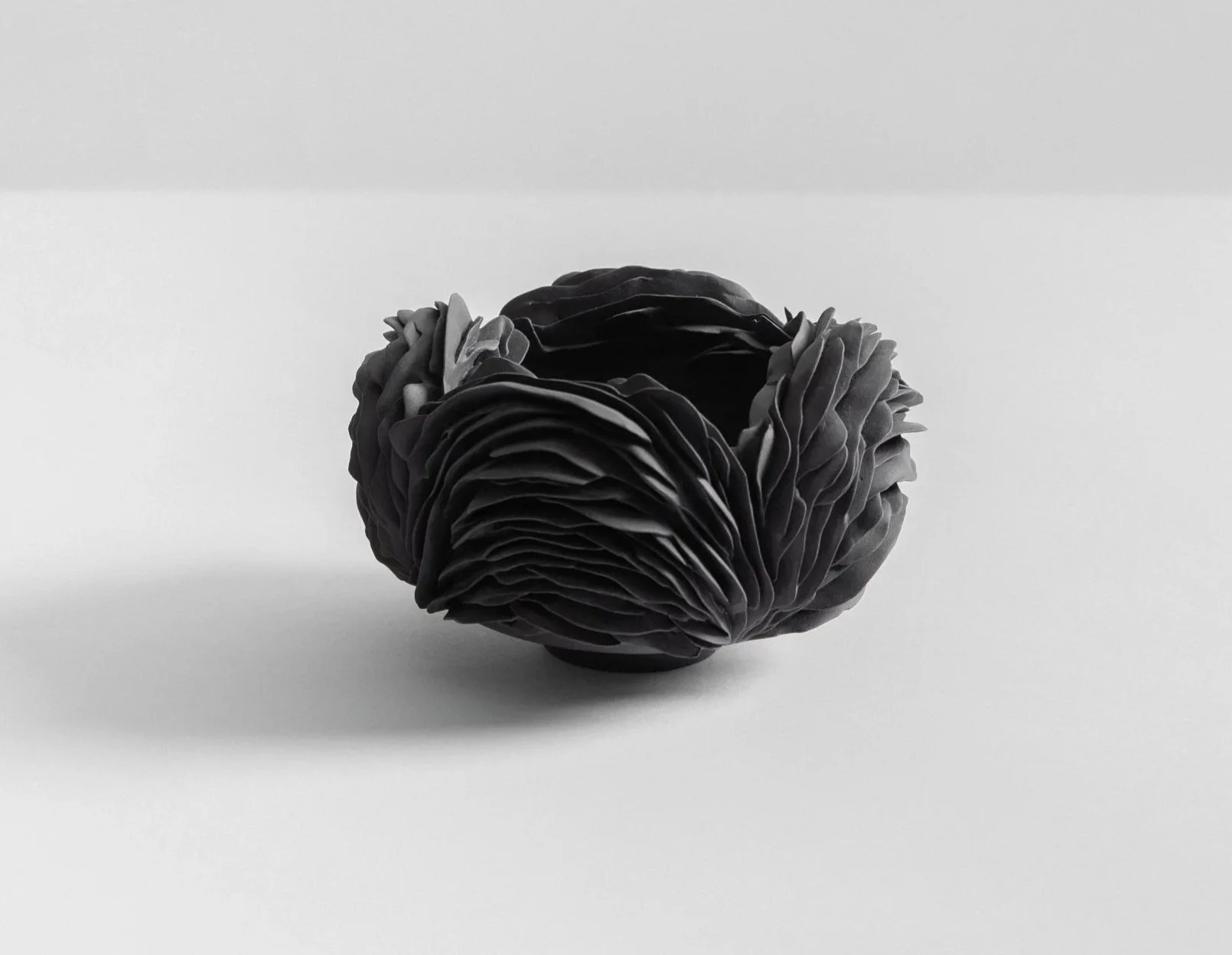 Black porcelain nest. 15cm W x 12cm H. 