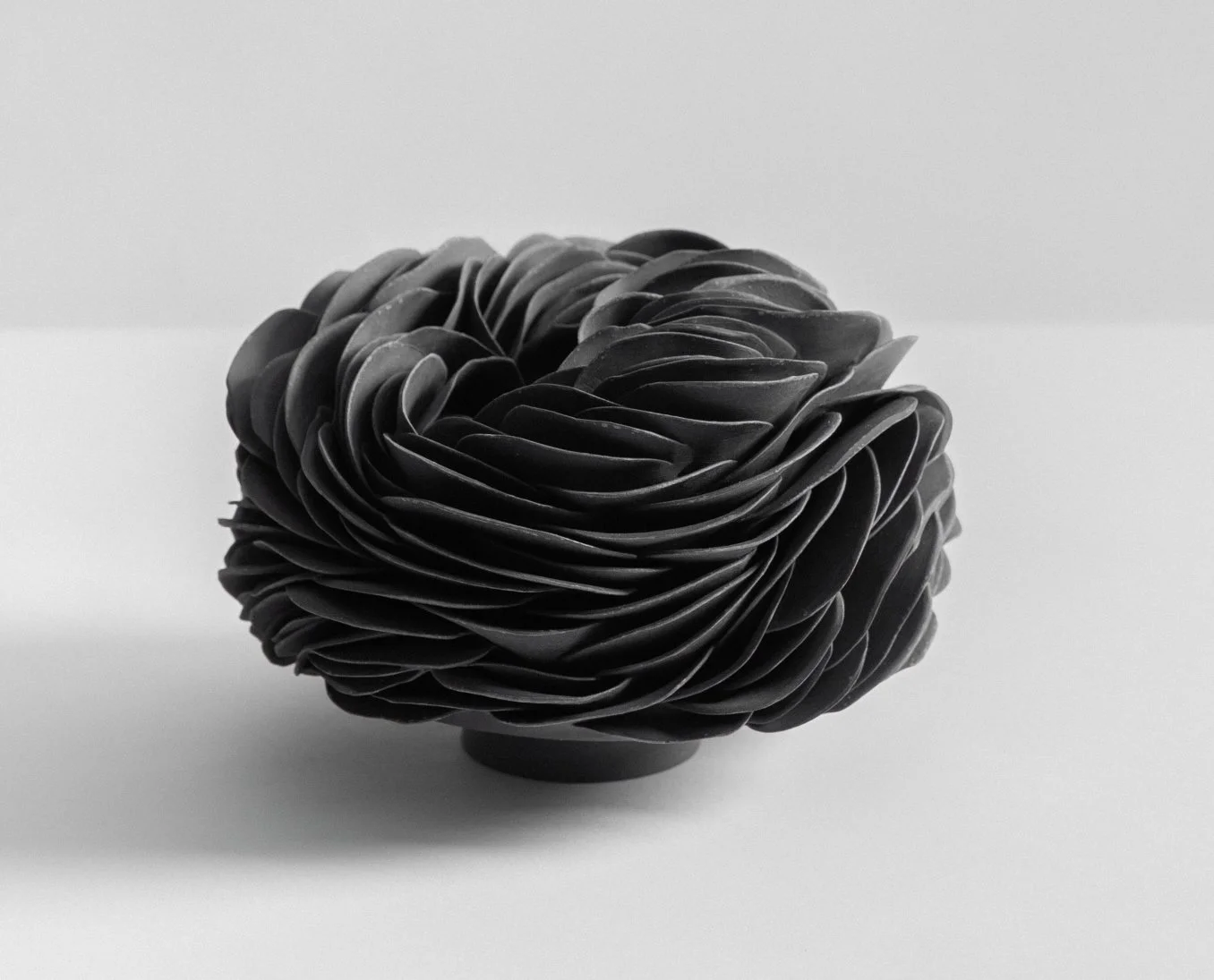 Black porcelain nest. 18cm W x 15cm H. 