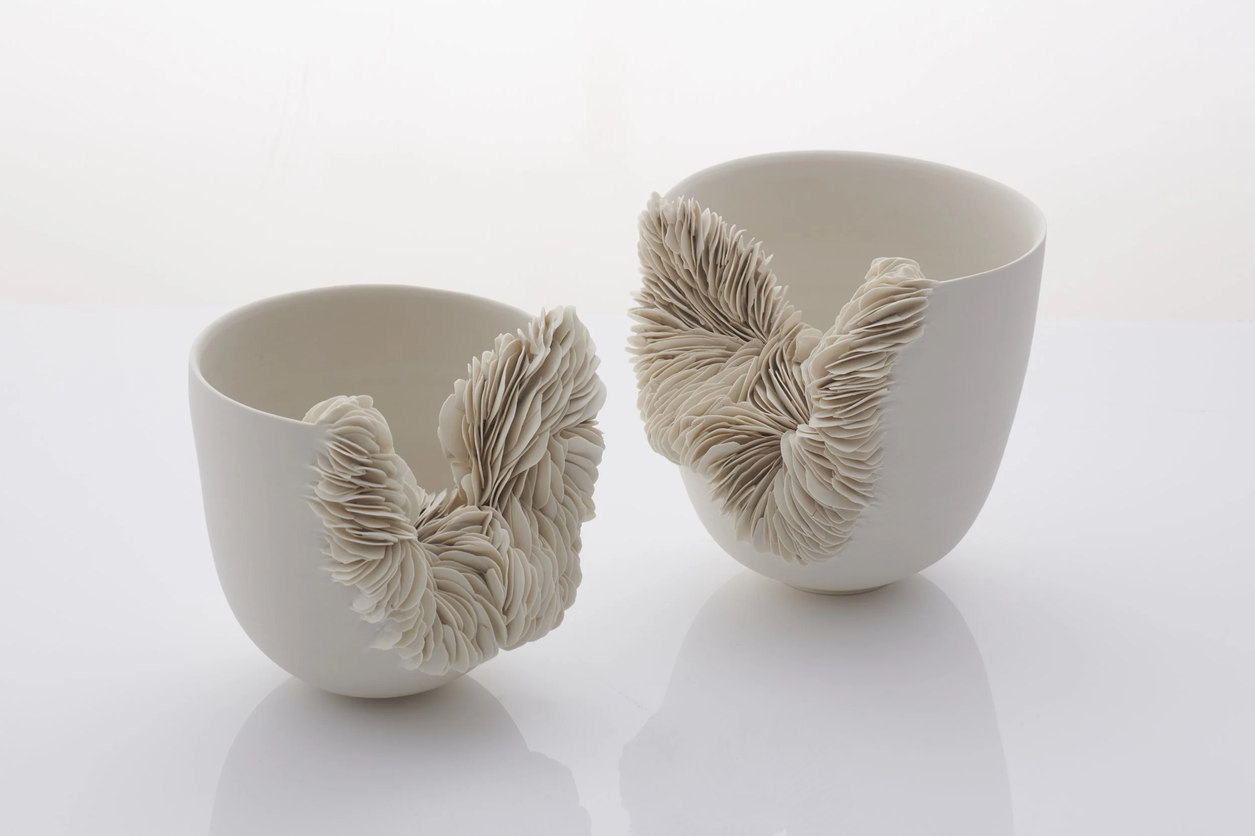 Pair of collapsed porcelain vessels. 