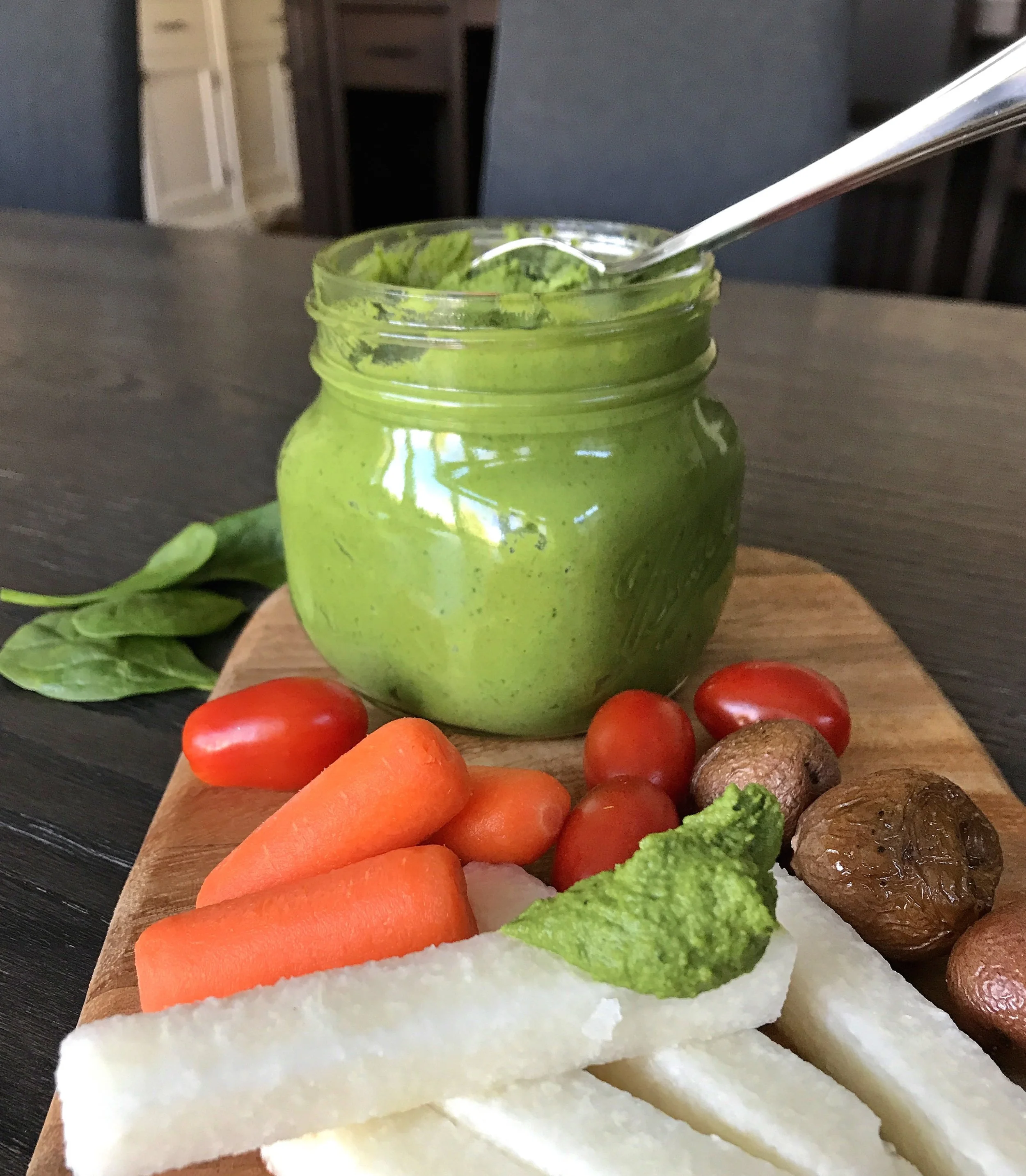 The Hulk Hummus with spinach and chlorella. Served here with grape tomatoes, baby carrots, roasted mini potatoes and jicama sticks.
