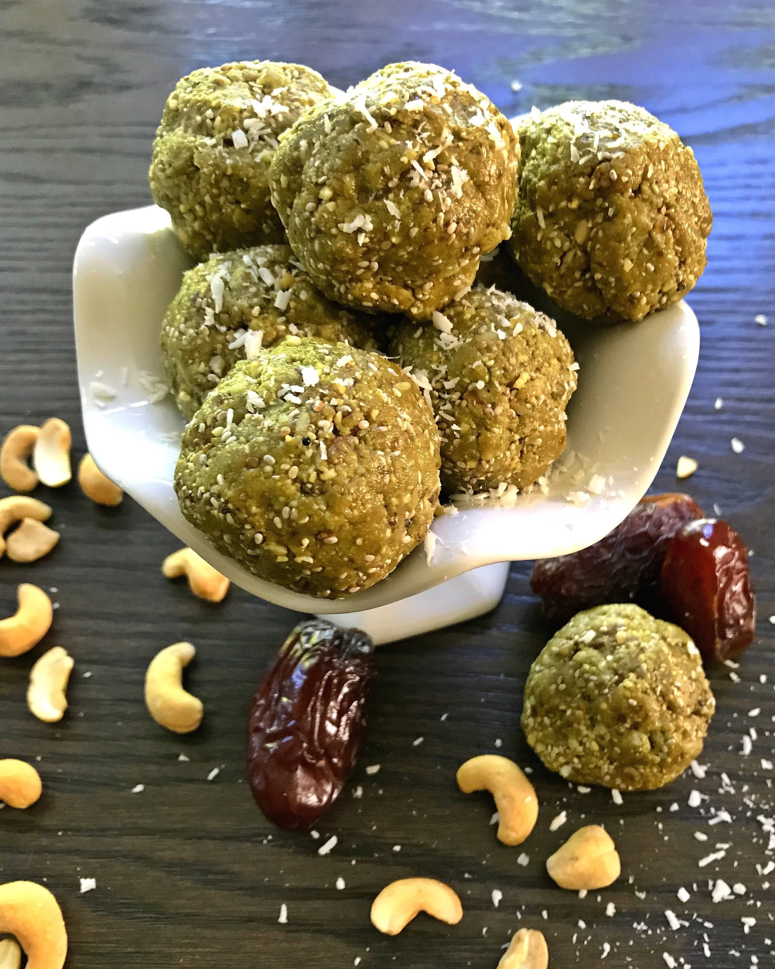 My 3 kids love to test my recipes. This is a photo of some Matcha Cashew Coconut Protein Balls my eldest made himself.