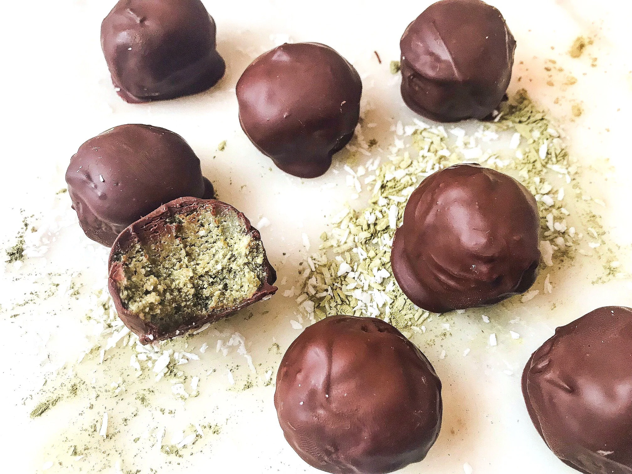 Matcha Coconut Protein Balls made with collagen and coated in vegan chocolate. Photo credit @hostofhealth.