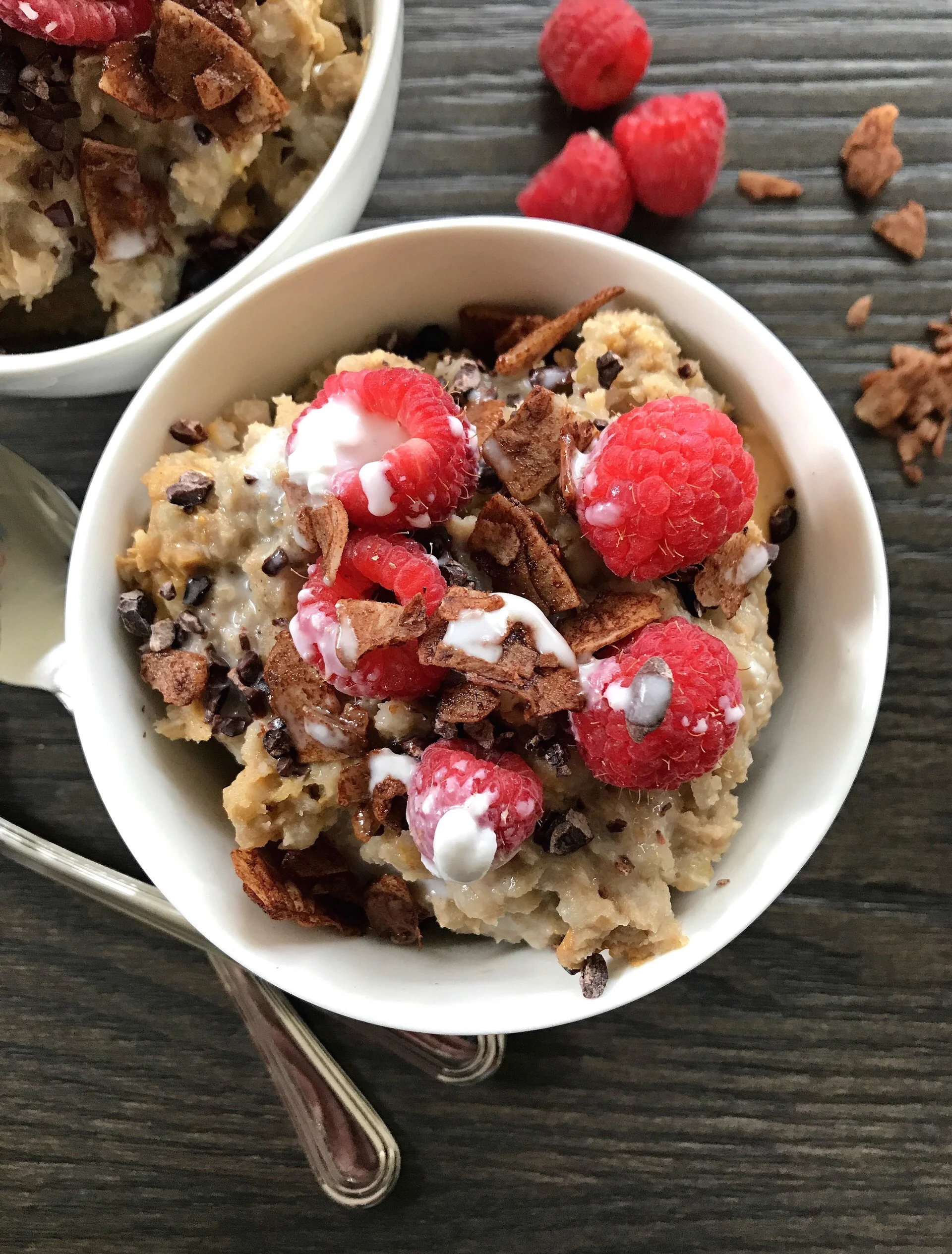 For 2 servings, I mixed 2 cups cooked buckwheat with 2 scoops Nuzest vanilla protein, 2 tsp maca powder, and 1 tsp pure vanilla extract. Then I swirled in some cashew butter and topped the bowls with raspberries, cacao nibs, chocolate coconut chips, and a drizzle of coconut milk.