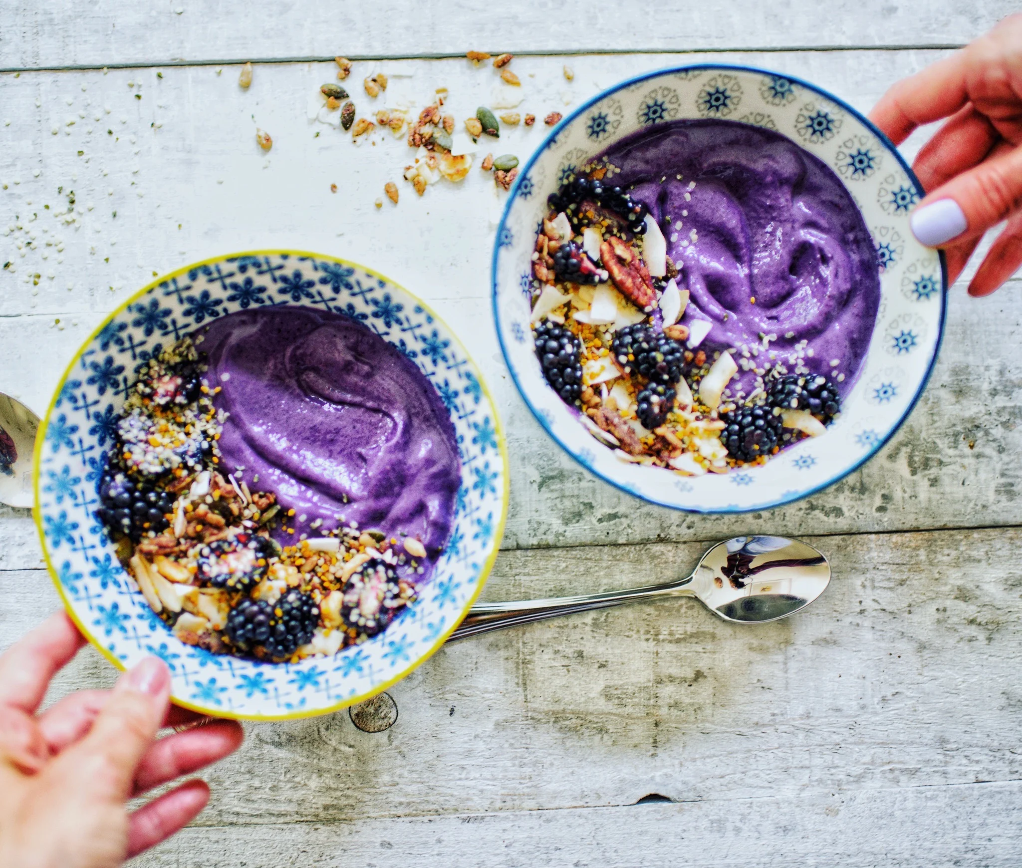 Purple Power Smoothie Bowls topped with paleo muesli, blackberries, and bee pollen. Photo credit @terianncarty.