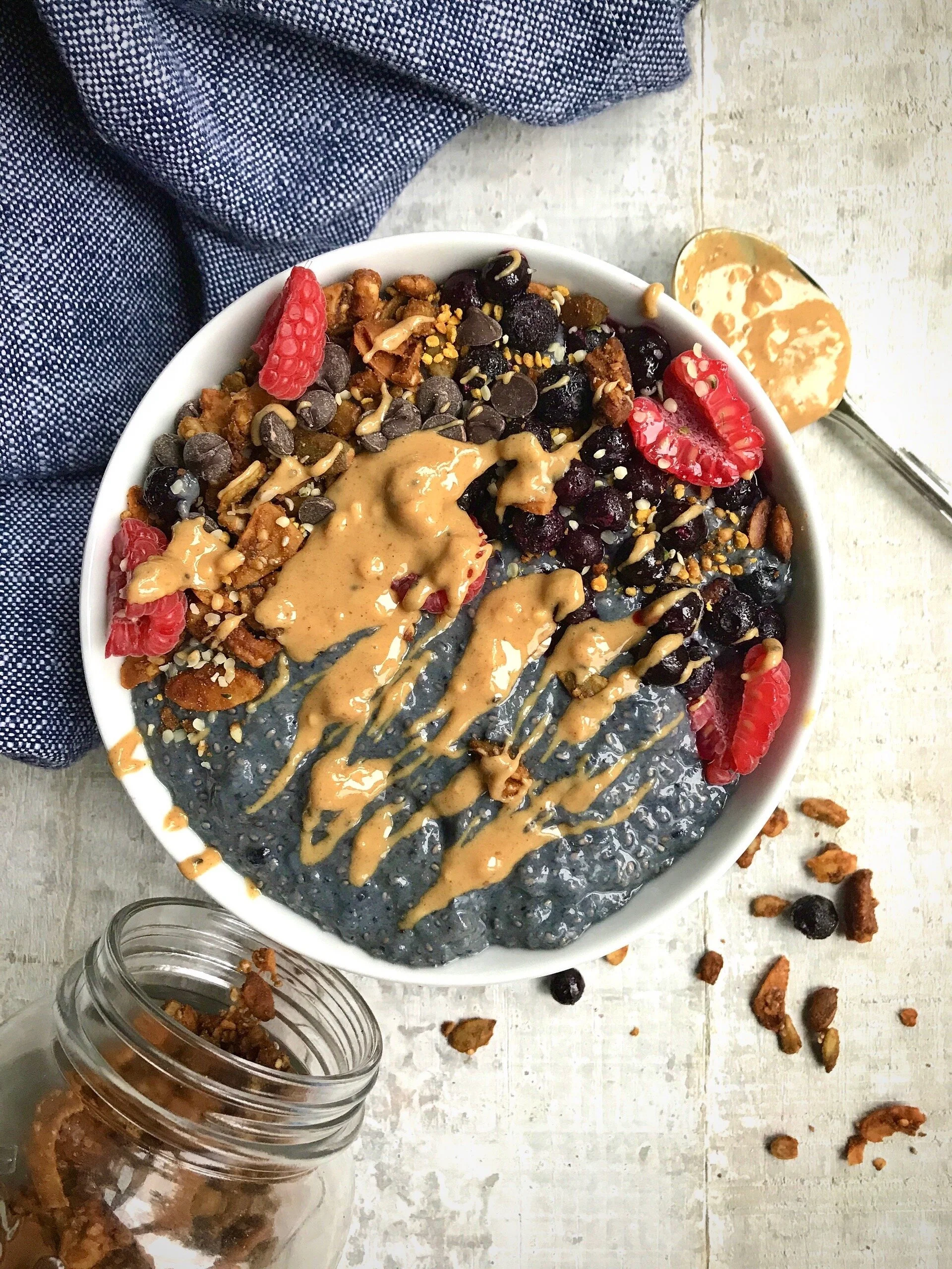 Boosted paleo almond version topped with frozen blueberries, homemade Paleo Pumpkin Spice Granola , raspberries, sugar-free chocolate chips, hemp hearts, Beekeeper’s Naturals pollen, and Fatso Salted Caramel Peanut Butter (omit for paleo).