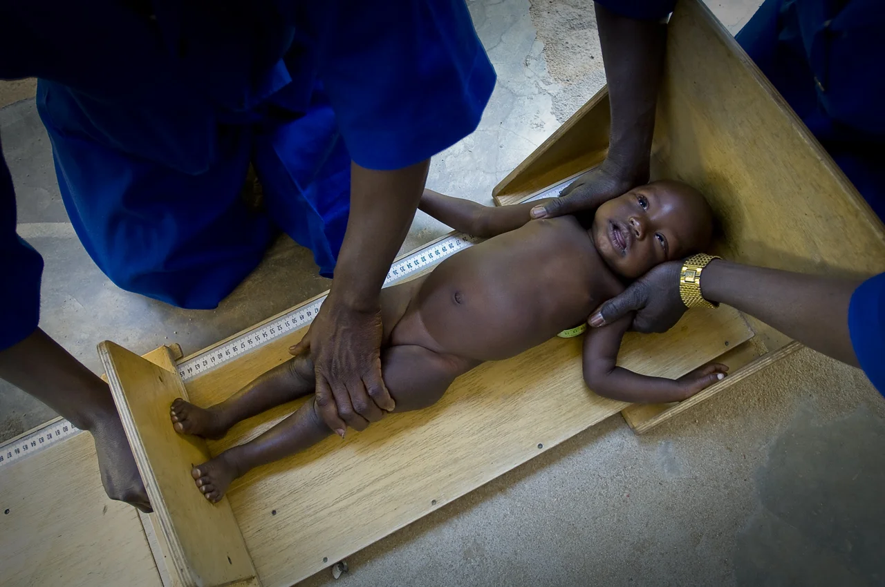 Treguine Health Center. First step of the monitoring process to determine the medical status of a child and particularly his growth, accurate criteria to monitor malnutrition, medical assistants measure a young refugee. Treguine camp (18 746 refugees on 30 september 2011), 23 kilometers south from Farchana, 120 kilometers east from Abeche, 72 kilometers from the sudanese border, was opened in september 2004.
