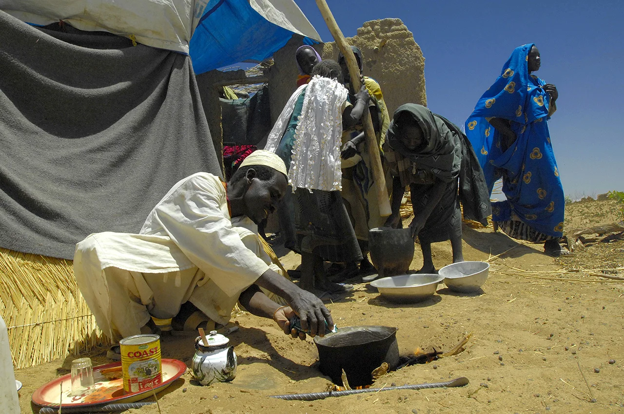 Darfurians refugees settled years ago in Birak. During a mourning period, a refugee is preparing tea for his guests. 