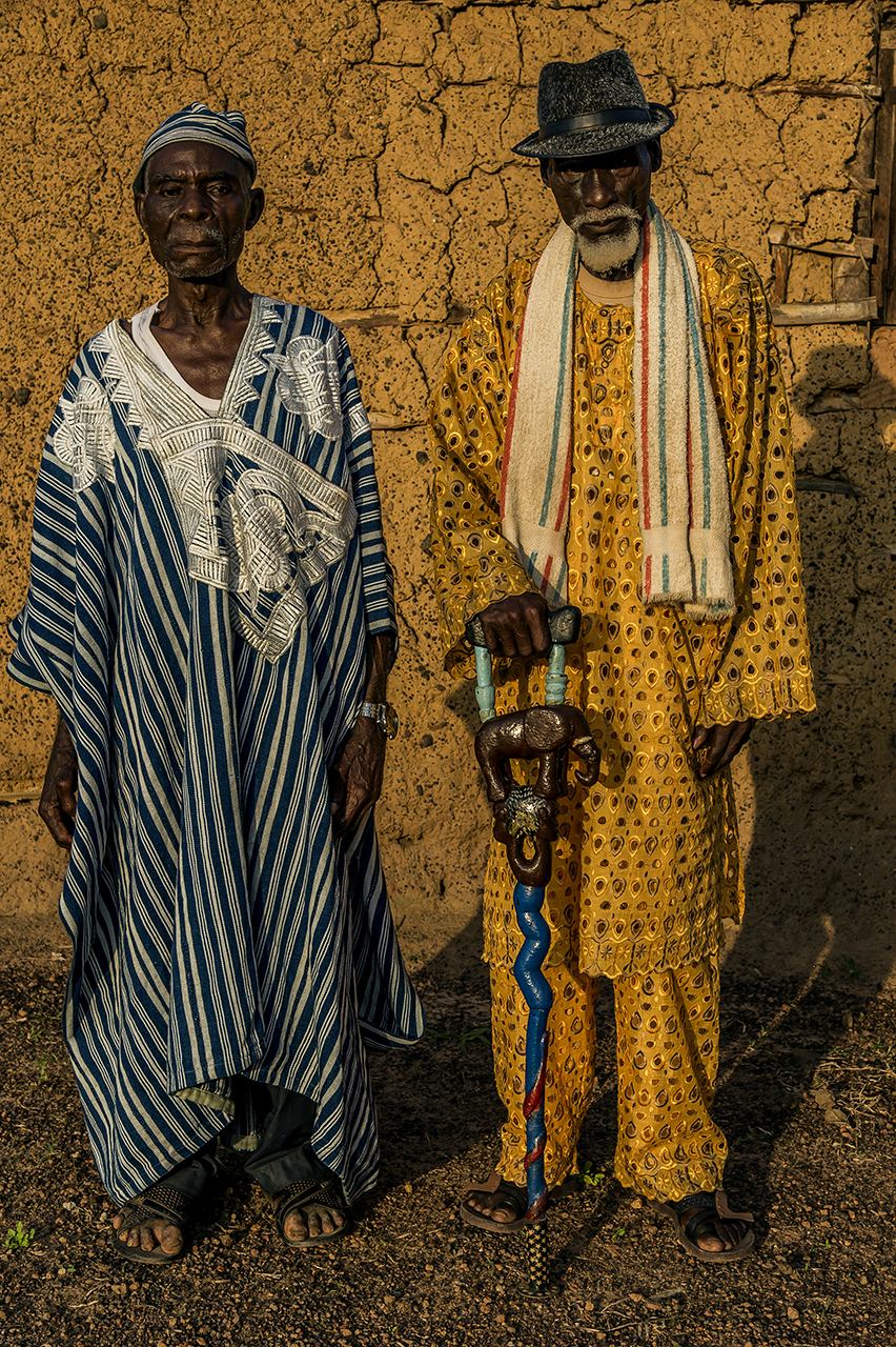 Village of Gouleako, on the road to the forest of Taï and its national park. An elder, actual village leader, Victor Tere of the Oubi tribe (left in blue) and a friend. "Formerly we were hunters and went into the forest. The whites took the forest.