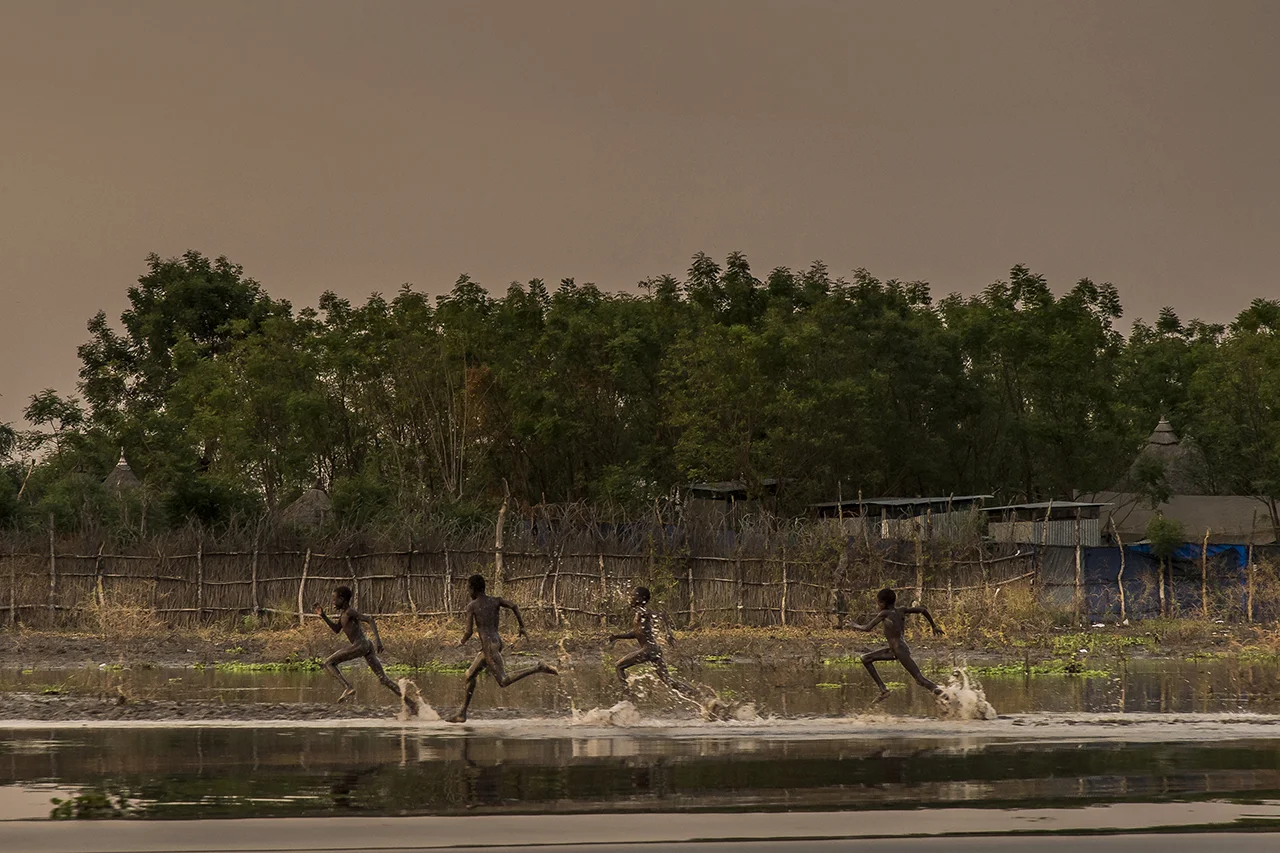 End of the day. Young boys run along the banks of the Pibor River at Akobo, the last rebel-held urban stronghold bordering Ethiopia. There is no doubt that government troops will attack this strategic crossroads sooner or later. Populations will surely scatter in the bush along the river towards the south and the north.