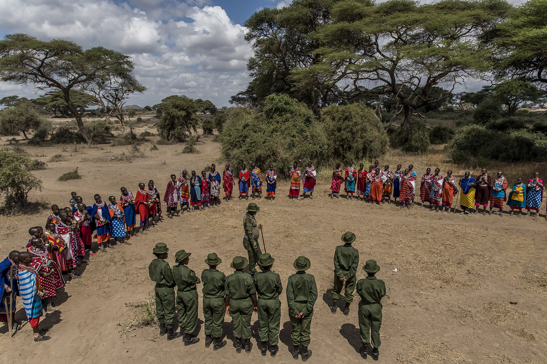 The group of female rangers from IFAW (International Fund for Animal Welfare) is introduced to the community of Masai women by Patrick Papatiti, a renowned ex-Moran (warrior). One of the aims of these rangers is to gain the trust of women in order t
