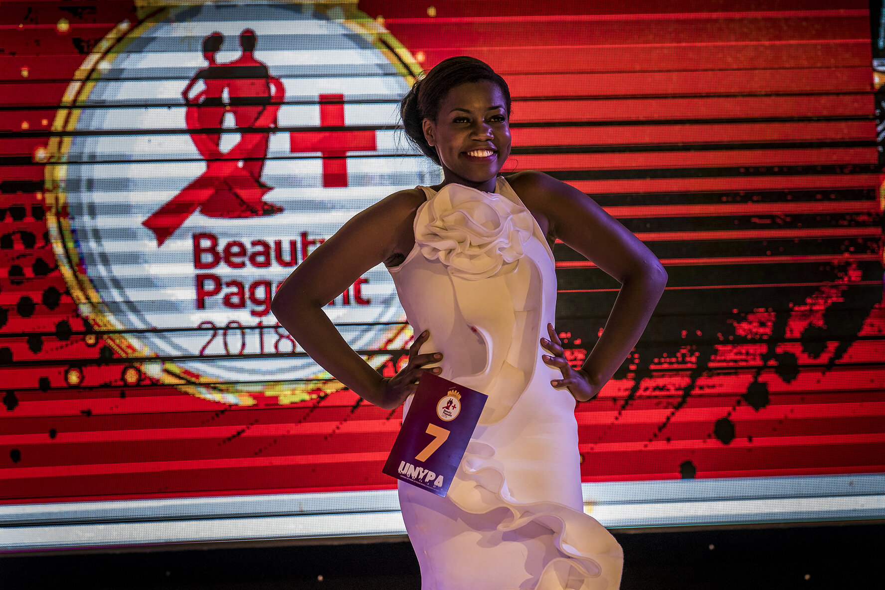 A female contestant in the Y+ beauty contest emerges from backstage, before setting off on the podium at the Sheraton hotel, dressed up in an evening dress, in front of more than 300 spectators. The first edition of the competition took place in 201