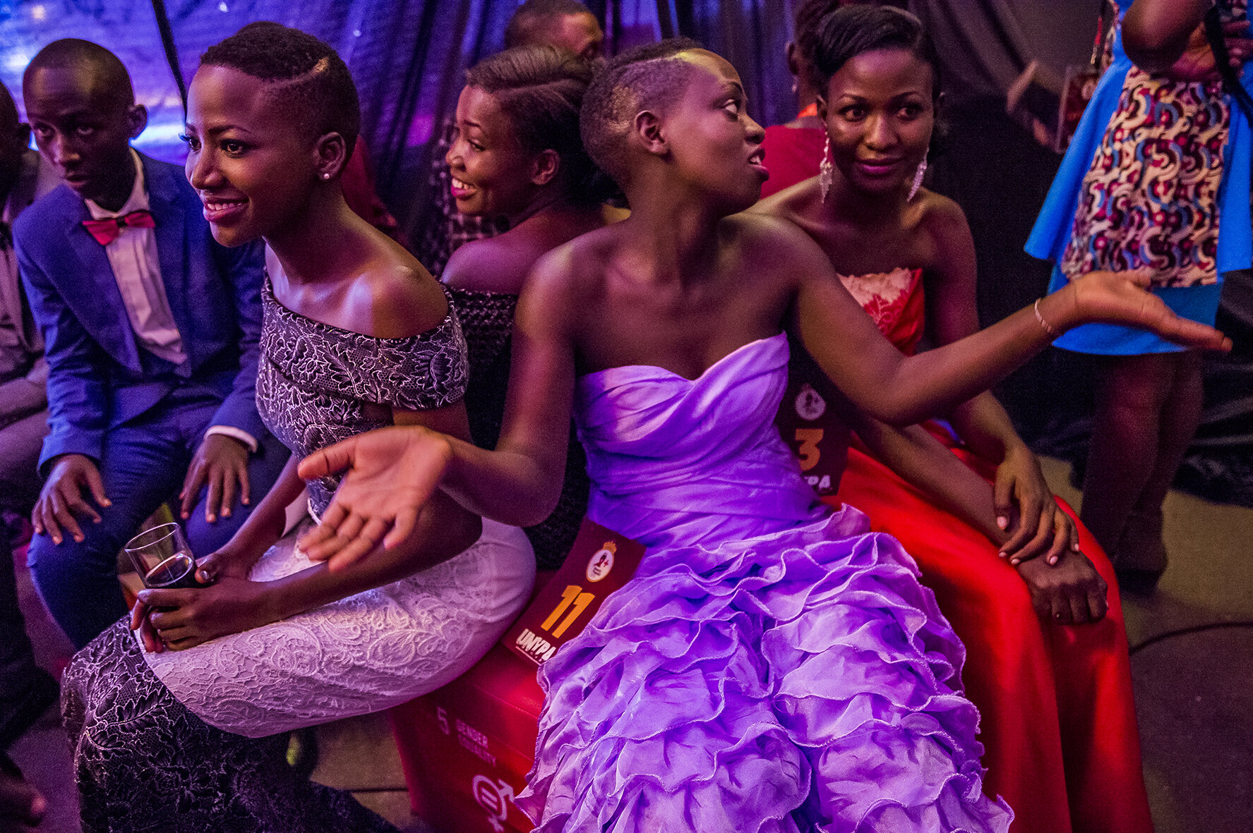 Backstage at the 4th edition of the annual beauty pageant for young people living with HIV in Uganda, an event to fight social stigma. A group of contestants wait for their catwalk. They all are HIV positive. Second from left is Sherina, 18 years ol