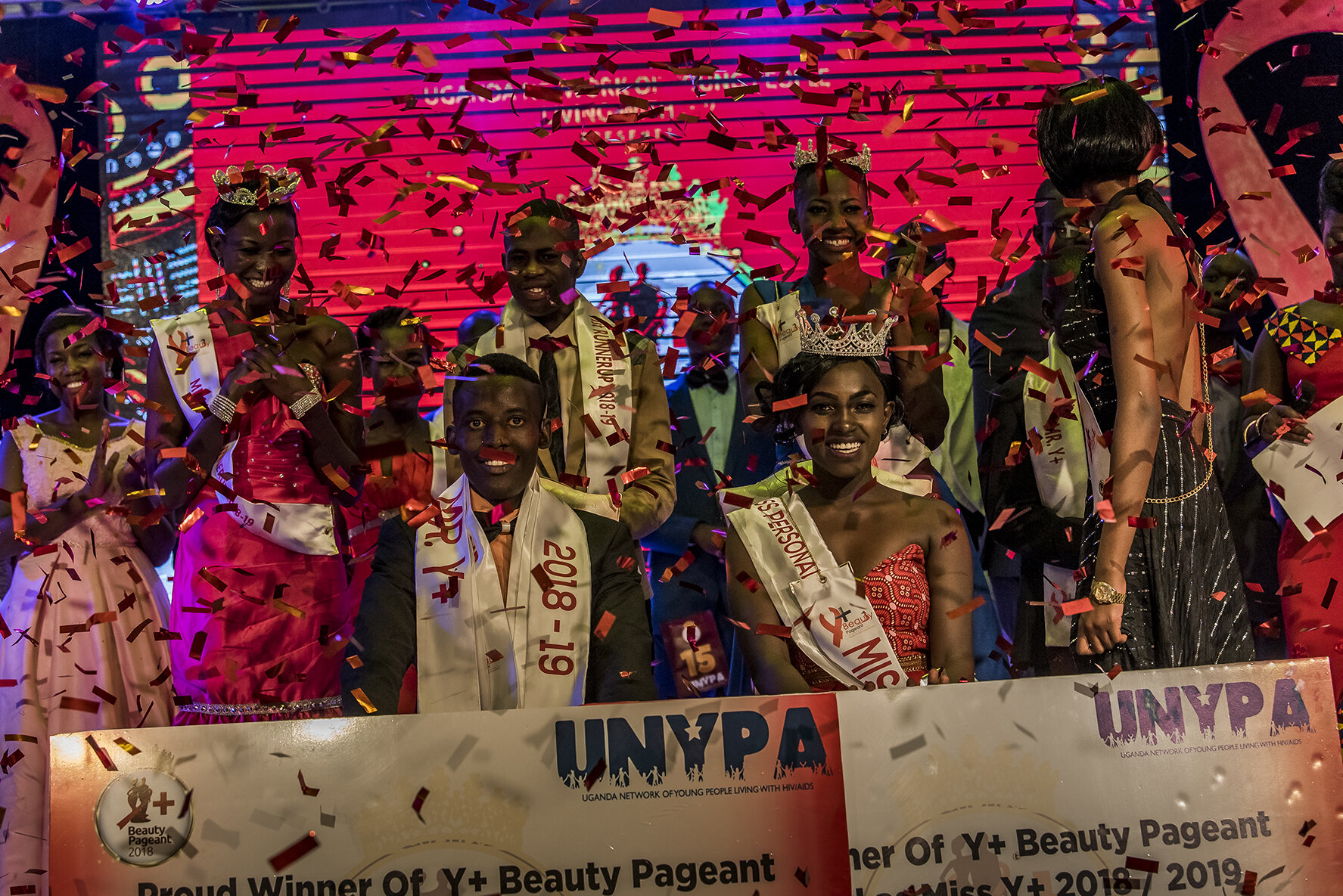 Surrounded by their runner-up, under a shower of confetti, Hillary Niwamanya and Vivian Alice Nabanoba are crowned Mister and Miss Y+ of the 2018/2019 edition.