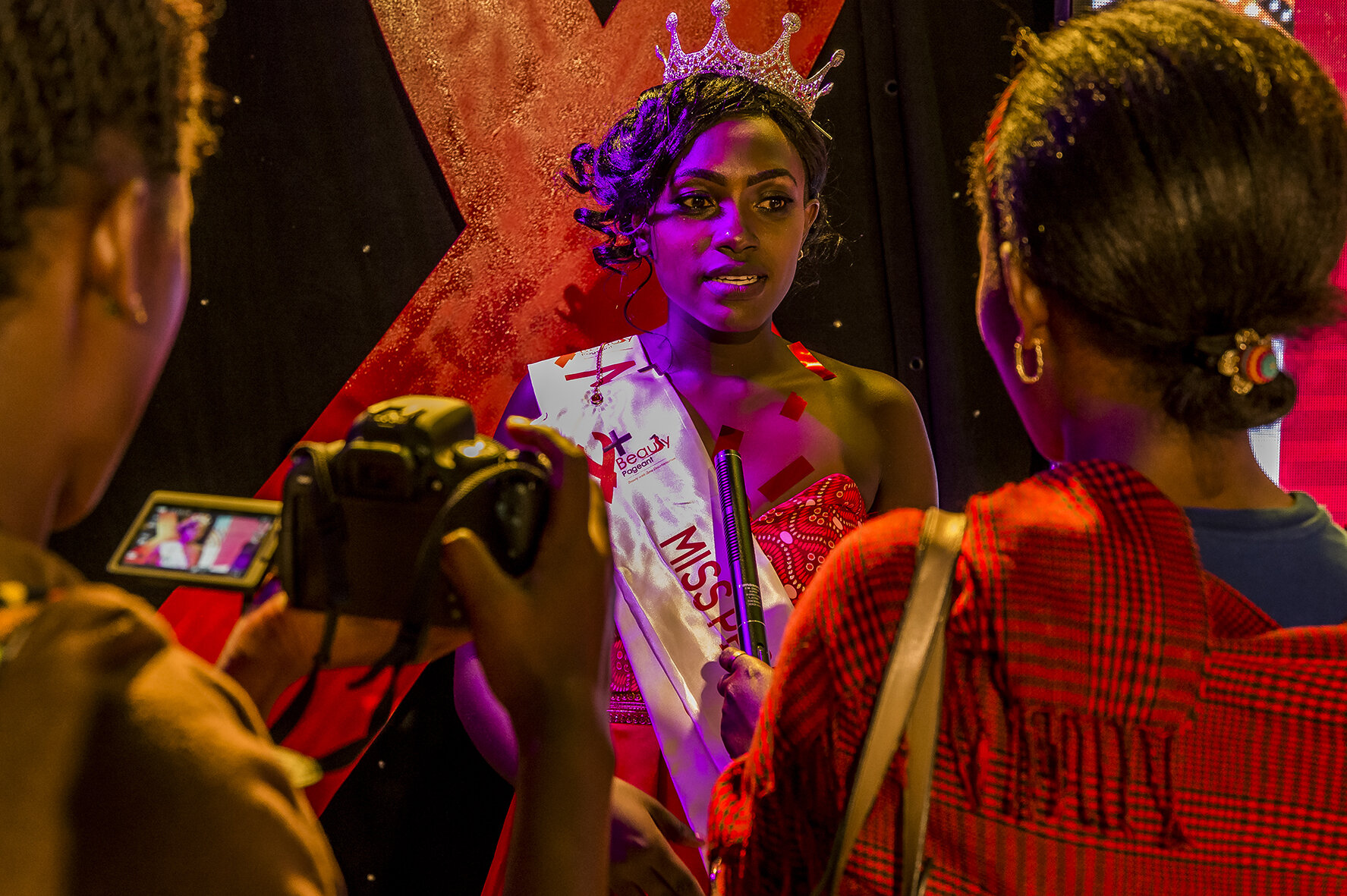 Moments after her coronation as Miss Y+ 2018/2019, Vivian Alice Nabanoba answers an interview for a local television in Kampala. Besides walking away with a full year scholarship financed by Uganda Network of Young People Living with HIV & AIDS