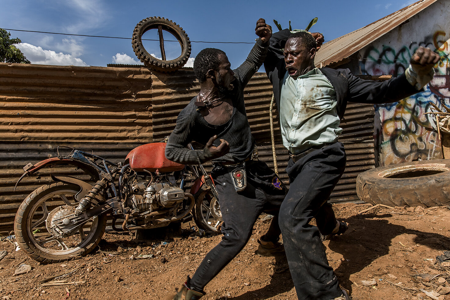  Two main actors, stunt and kung fu practitioners of Wakaliwood, Appollo ASIIMWE and Kasekende Mustafa KATWALO a.k.a. Mustafa Lee fight each other in a remake of the Japanese Movie, Rashomon. The project is sponsored and initiated by a French artist,