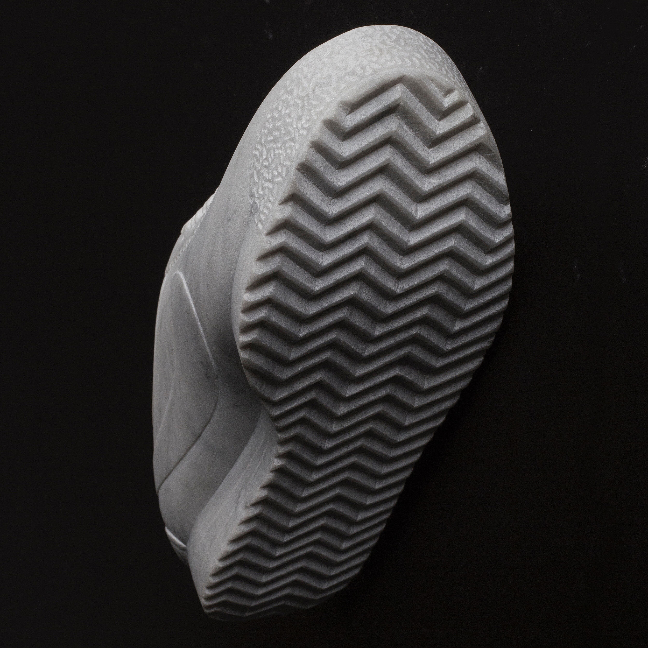 Detail of a hand-carved marble sneaker by Alasdair Thomson.