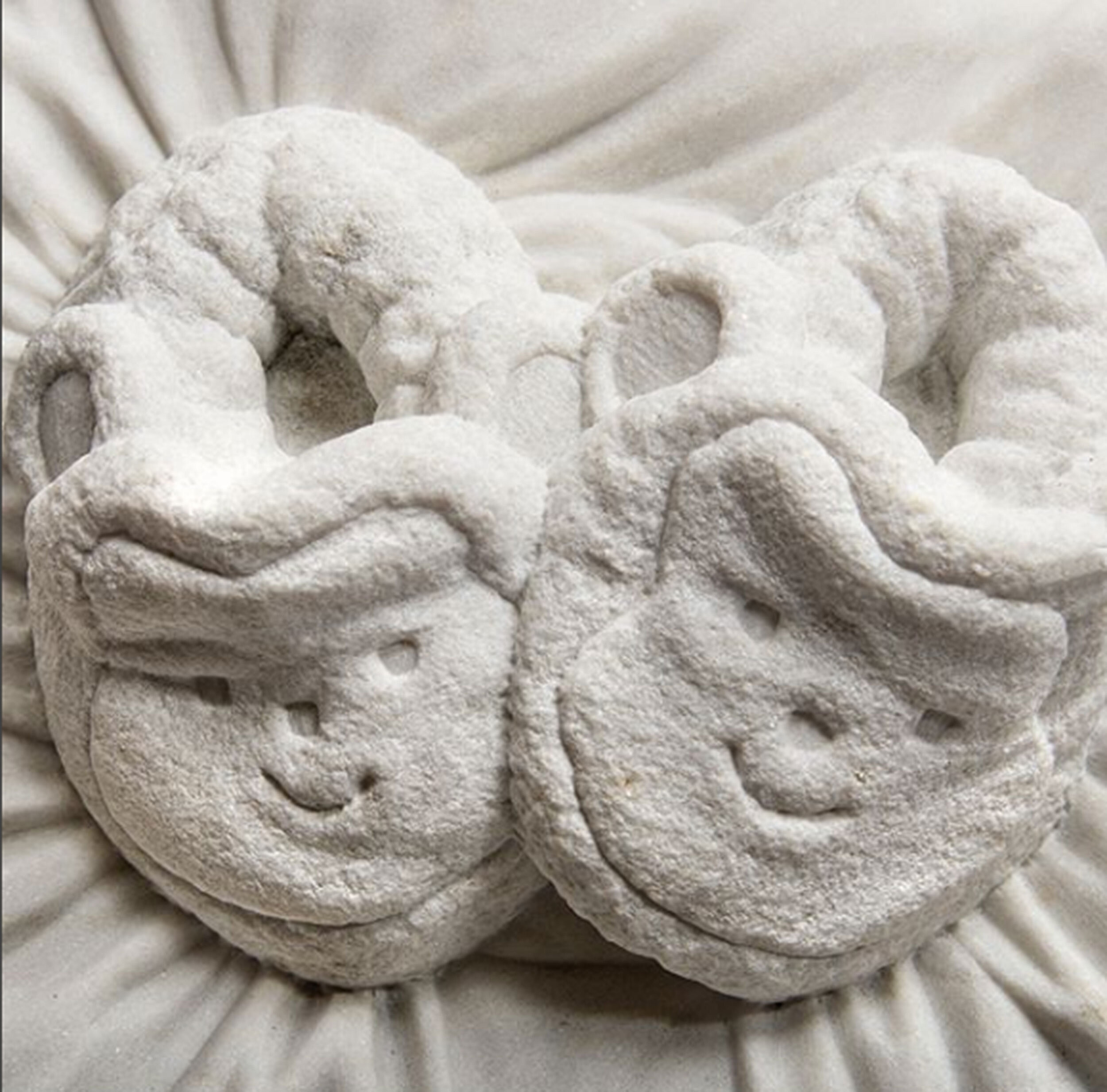 Hand-carved marble slippers sculpted by Sebastian Martorana.