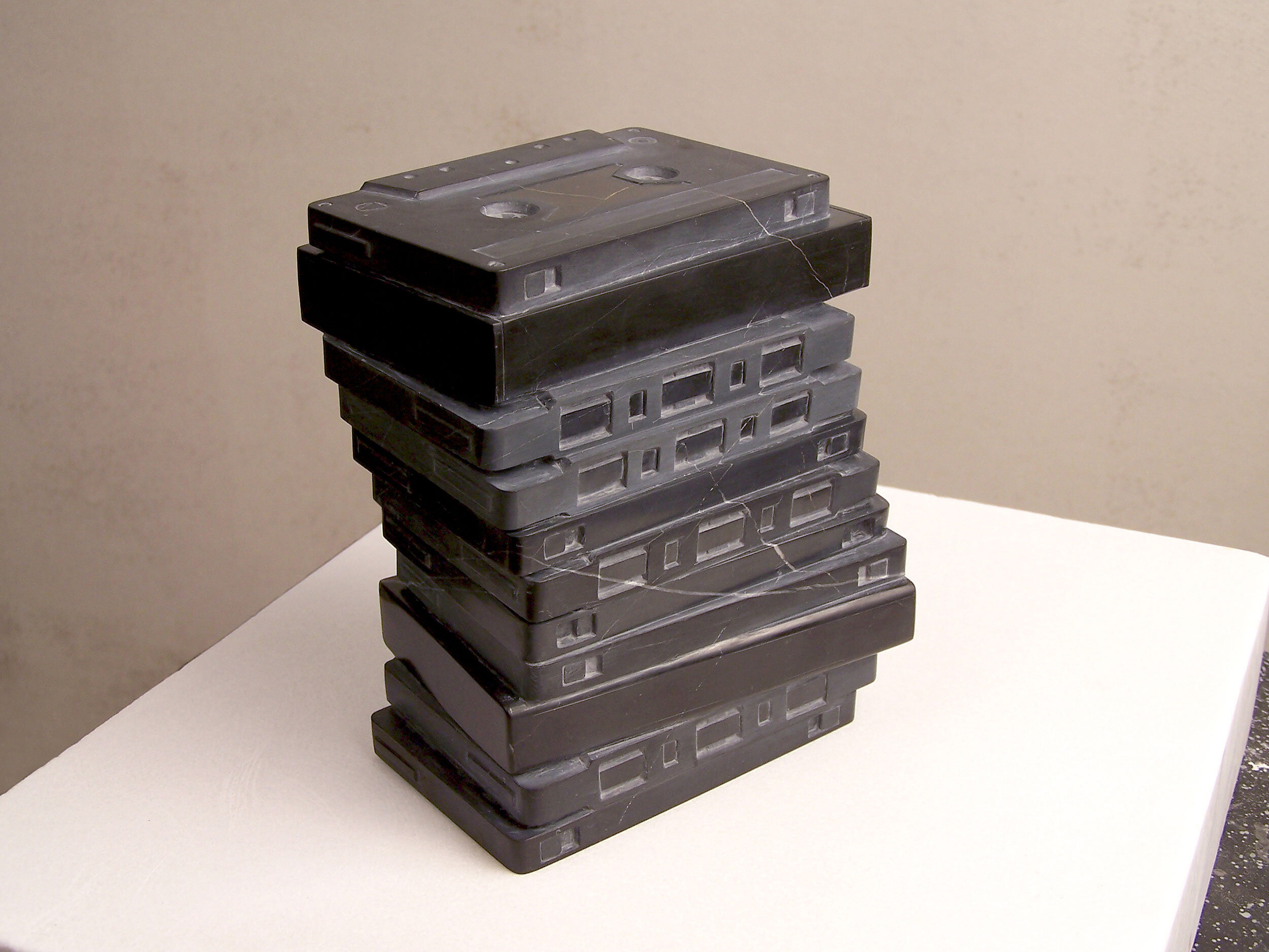Hand-carved black marble cassette tapes by Peter Glenn Oakley.