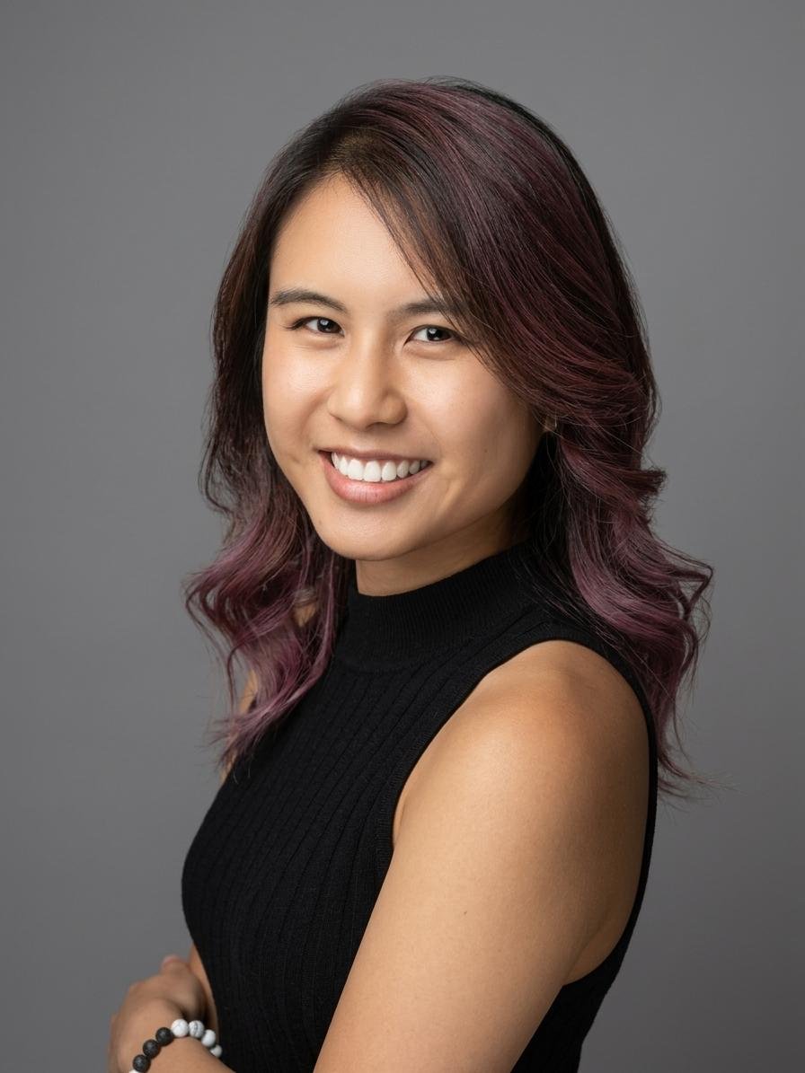 Headshot of Casey Chin, a Senior Product Designer, smiling against a neutral background.