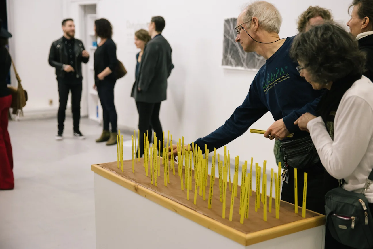 Bill Horne's Stakes in the Peace transforming over the course of the exhibition opening, as donations were made and stakes were added to the terracotta base. May 2017. Photo by Denis Gutiérrez-Ogrinc. 