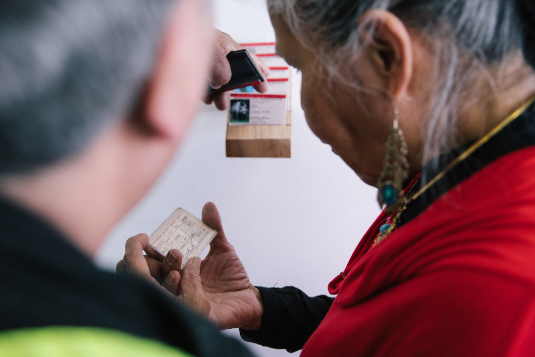  Jennifer Annaïs Pighin.&nbsp; Native Status Cards.&nbsp; 2017. Visitors examining the cards.&nbsp;Photo by Denis Gutiérrez-Ogrinc.&nbsp; 