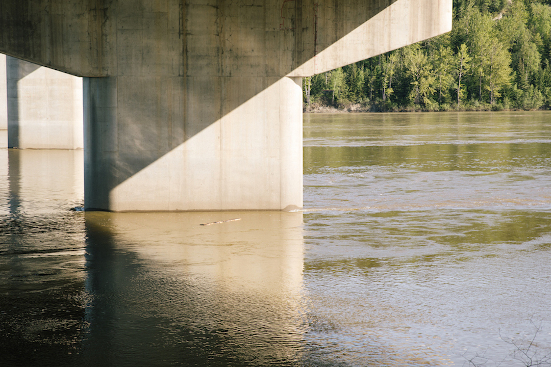  Andrew Maize.&nbsp; nations are narrations . 2017. Detail of work in progress. Chiselled plank tossed into the Fraser River. Photo by Denis Gutiérrez-Ogrinc. 