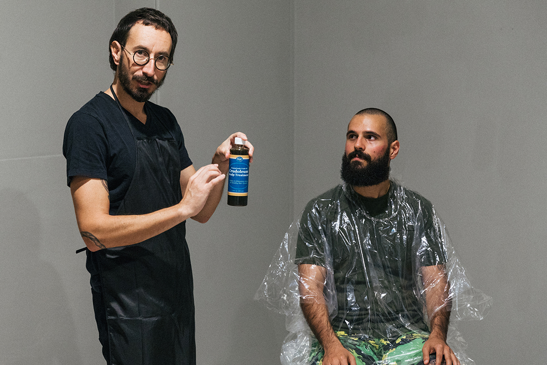 Elia Vargas’ crude oil hair washing performance and speculative talk in the PLOT space. July 27, 2019.