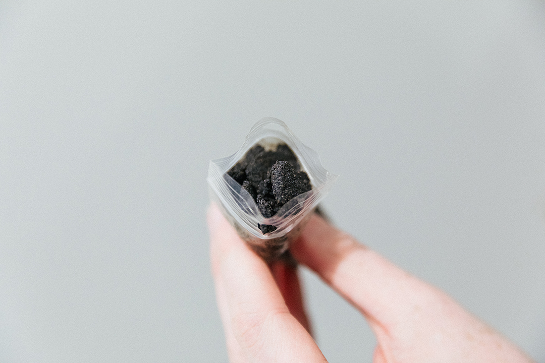 Bitumen sample in a plastic bag provided by Ruth Beer for display in the PLOT space.