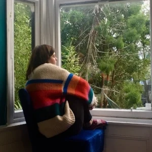 3rd year student, Gemma Oxley, by one of the bay windows in The Lighthouse