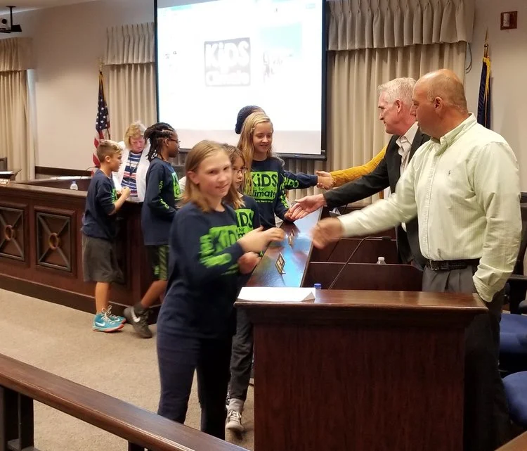 Oaklandon Kids for Climate meet Lawrence city councilors before Sept. 5 meeting.