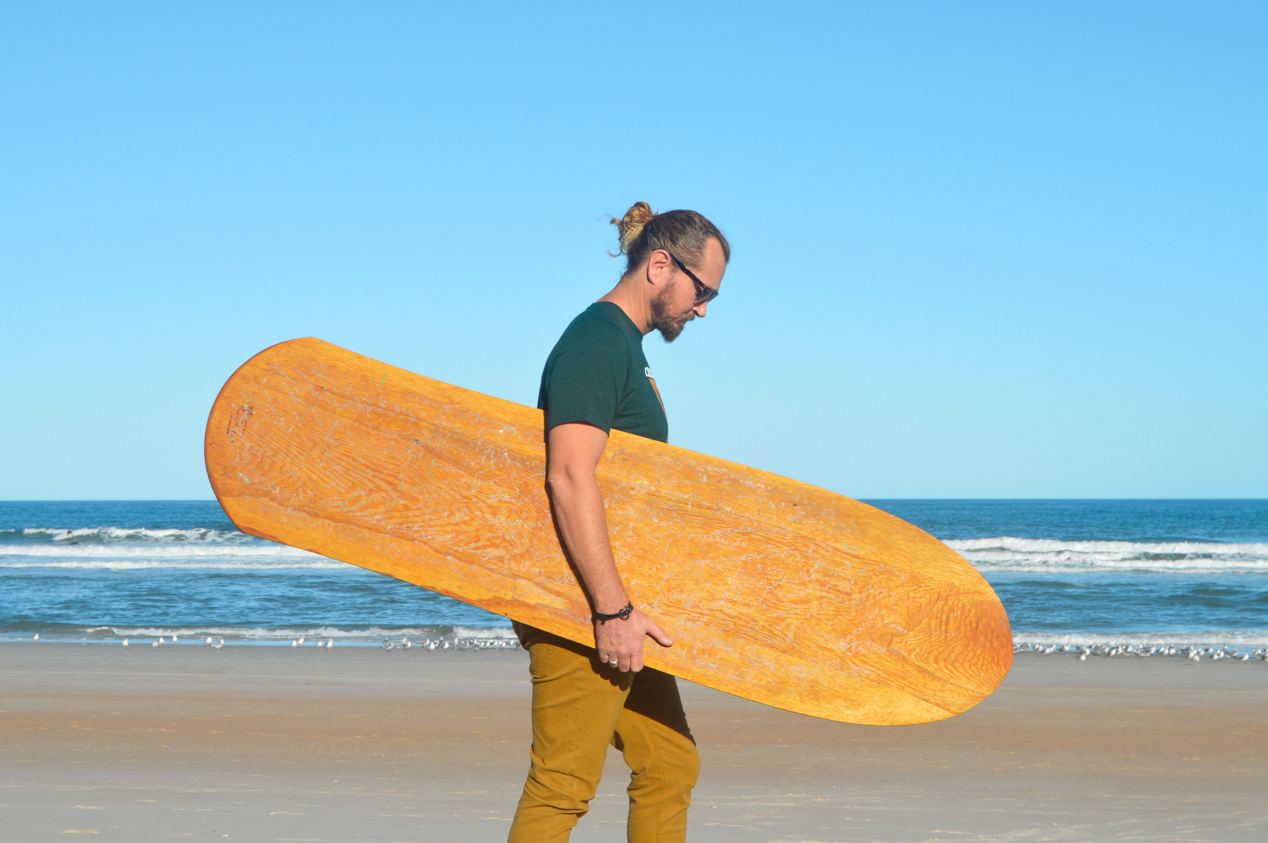 Brandon Russell with one of his self-made, hand-shaped alaias, 2017 Photo: Siren Williams