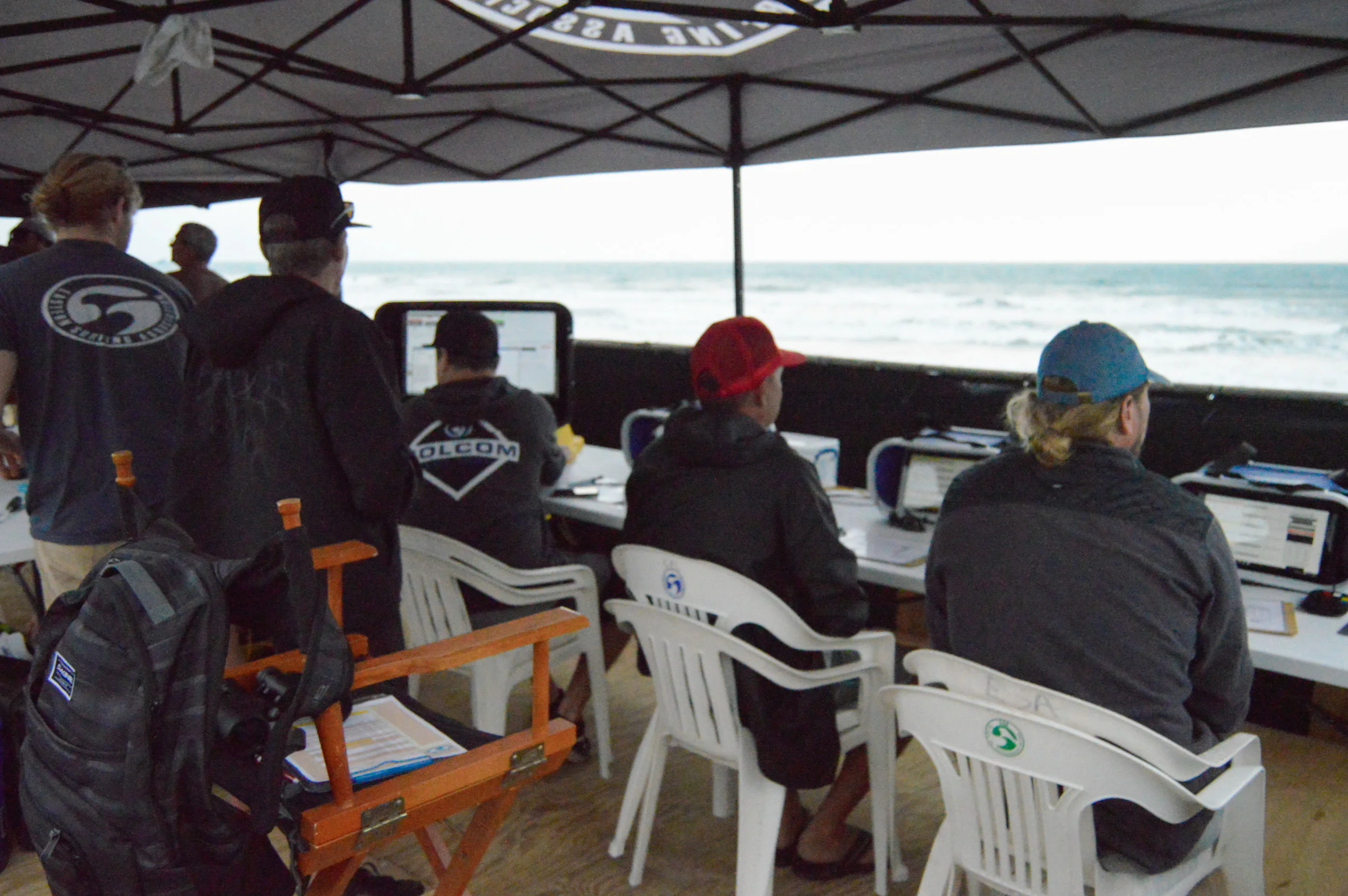 Dylan O'Donnell (running the computer system),&nbsp;Chip Hall (judge), Jeremy Saukel (judge), Barry Pasonski (judge), and Brandon Russell (judge) judging the ESA South East Regional Surfing Championships at Paradise Beach, FL in 2018. (Not pictured:…