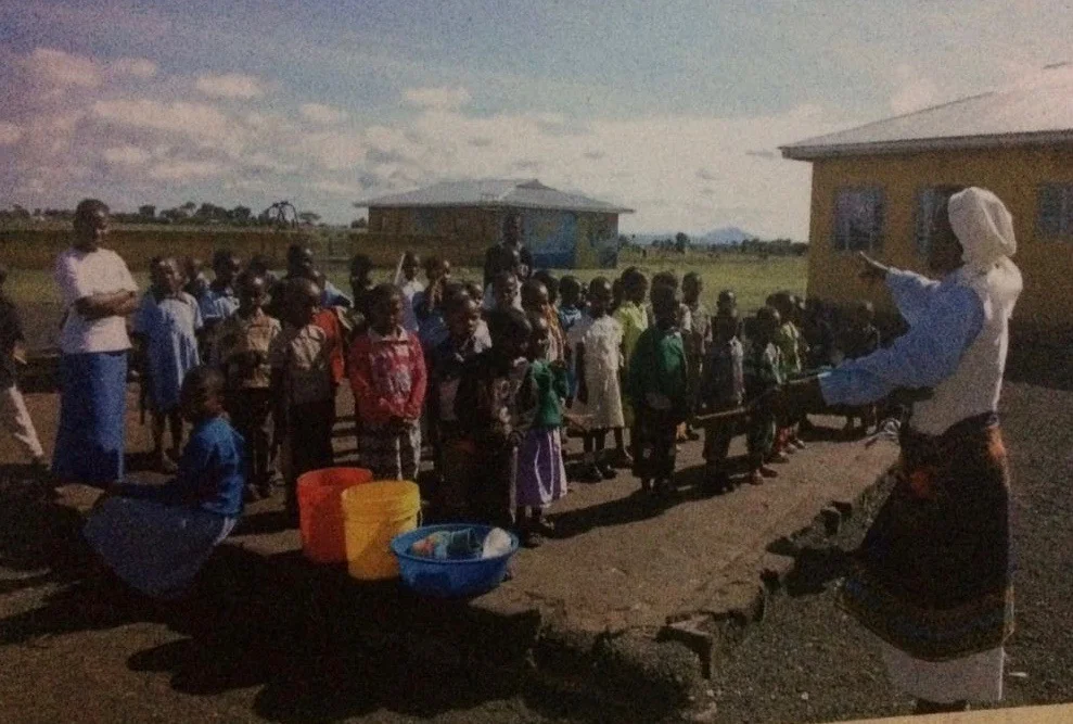 Mamee (standing left) has been with Sister since the beginning -- for years it was just the two of them caring for all the needs of the children. (Photo from 2000.)