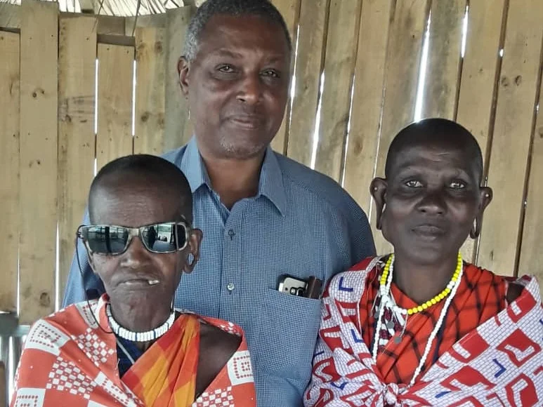 Dr. Gideon with two Maasai women who recently had surgeries sponsored by Unite. Namayani had cataract surgery and can now see well. She wears dark glasses for dust and sun protection. Mariam had surgery to remove a goiter. She will need a follow up surgery but is feeling strong and well.