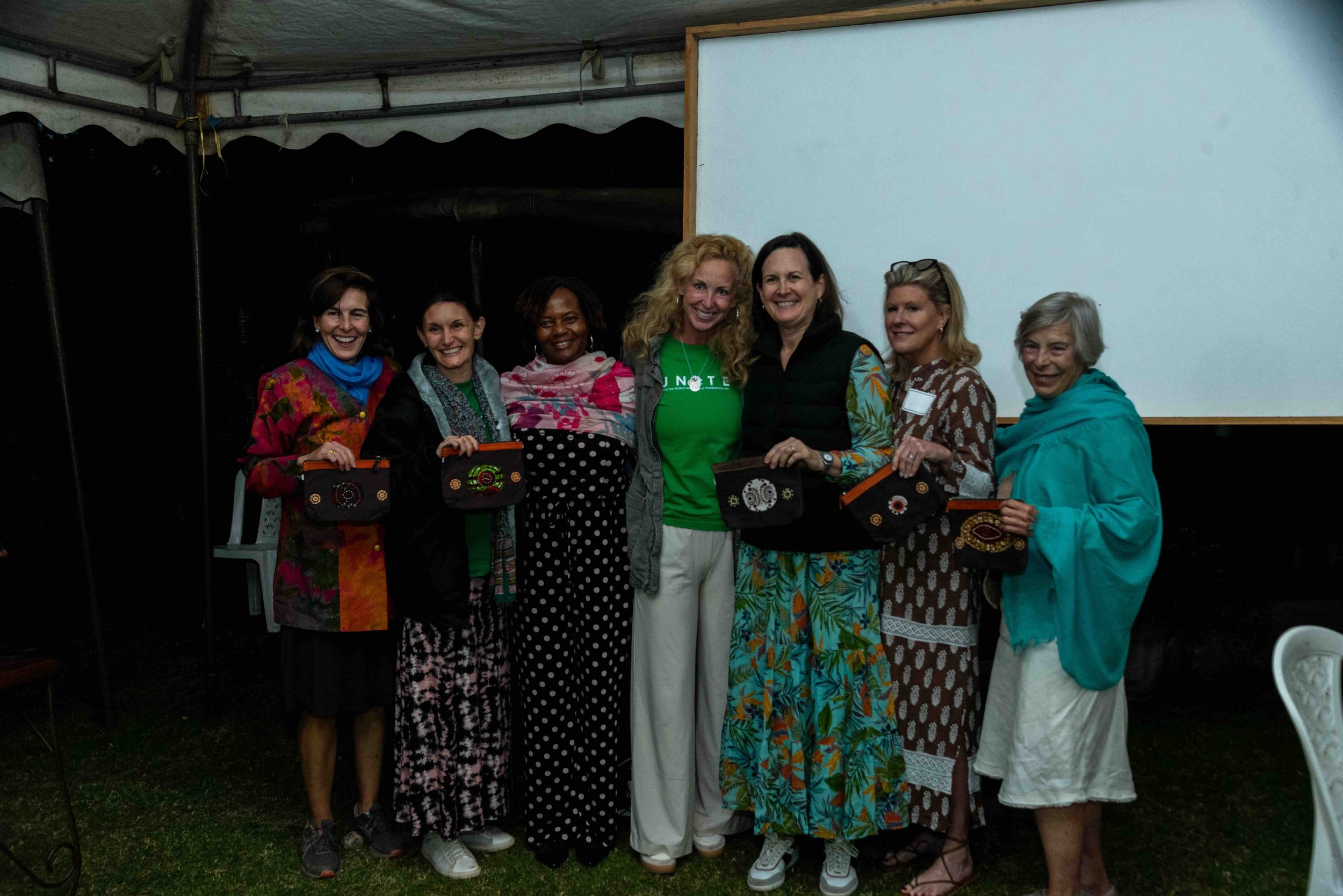 2025.10.17_Unite USA team photo with their gifts given by Anne Wells.jpeg